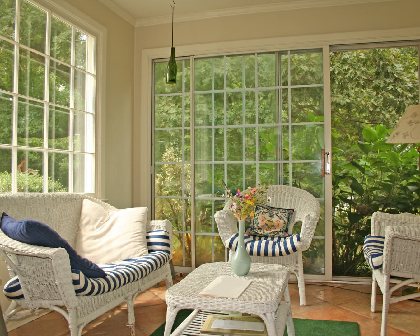 Sunroom inspiration with an enclosed windowed addition designed to bring in natural light.