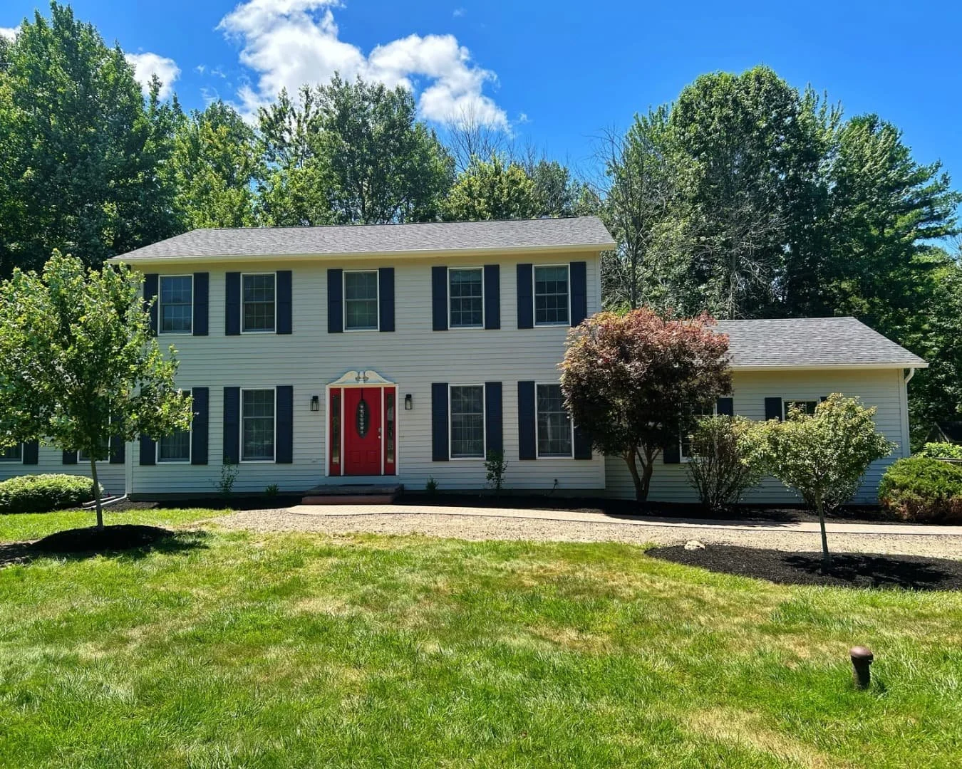 Front walkway and foundation bed completed by Pines and Pavers in Manlius, New York.