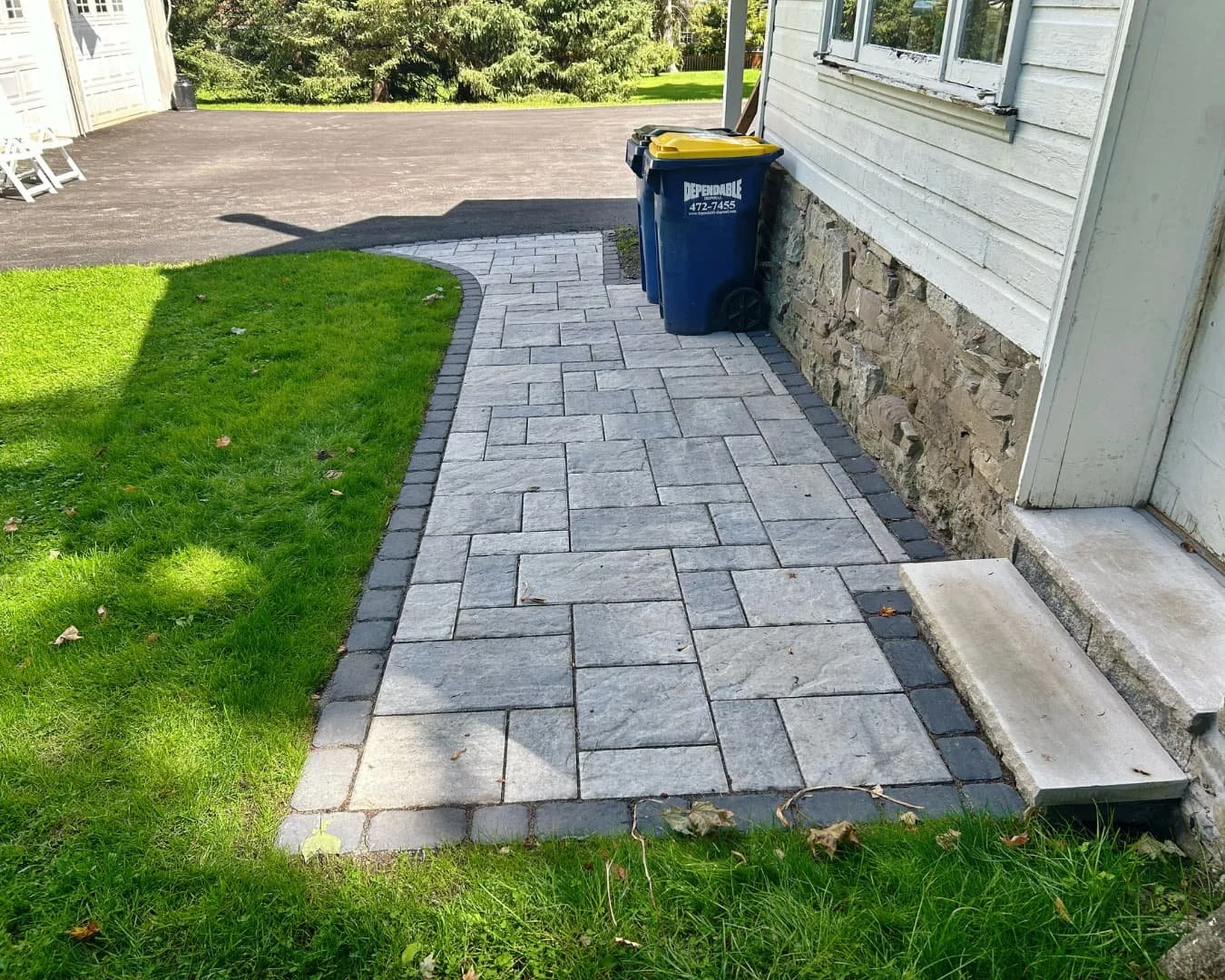 Completed side yard paver walkway by Pines and Pavers in Cicero, New York.