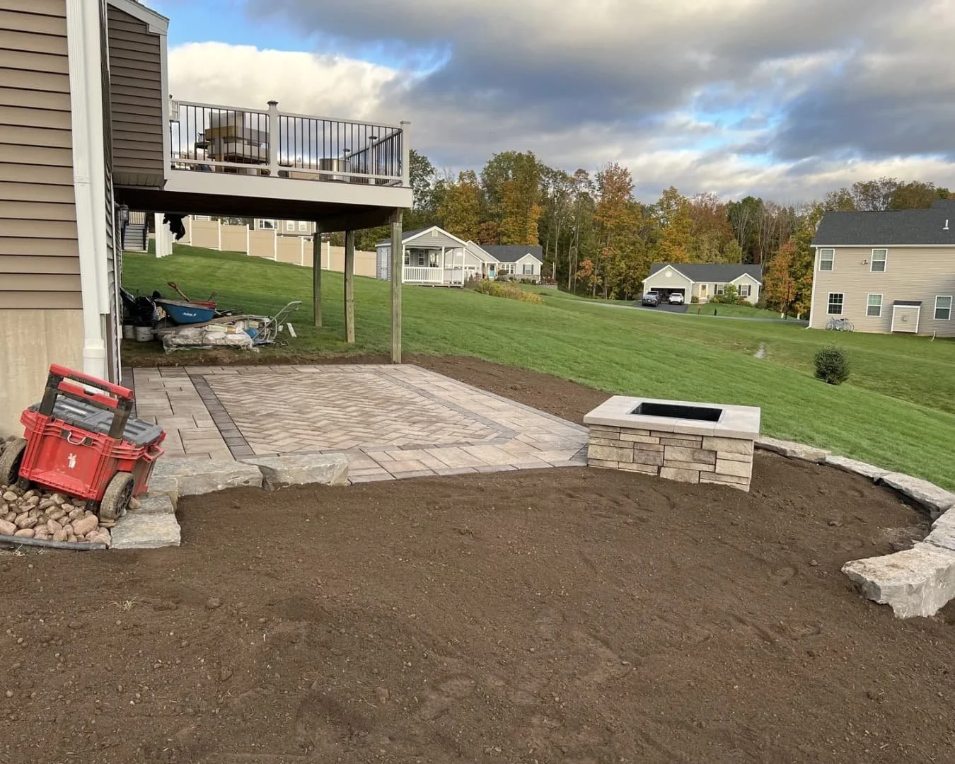 Backyard patio and retaining features under construction at a Baldwinsville, NY property.