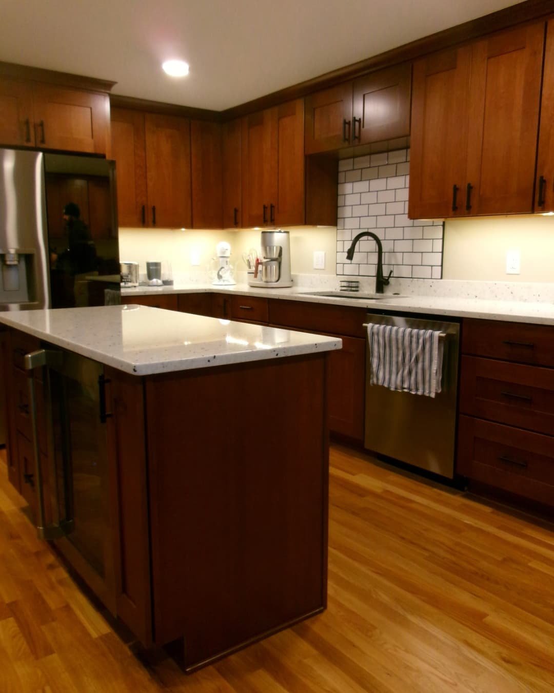 Kitchen corner counter view in an Upstate New York remodel with granite countertops, backsplash tile, and updated cabinets.