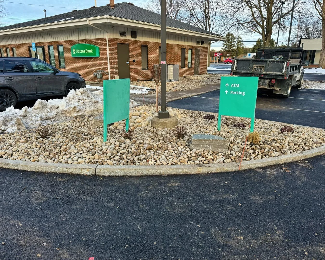 Tree ring landscape bed at Citizens Bank completed by Pines and Pavers in Cicero, New York.