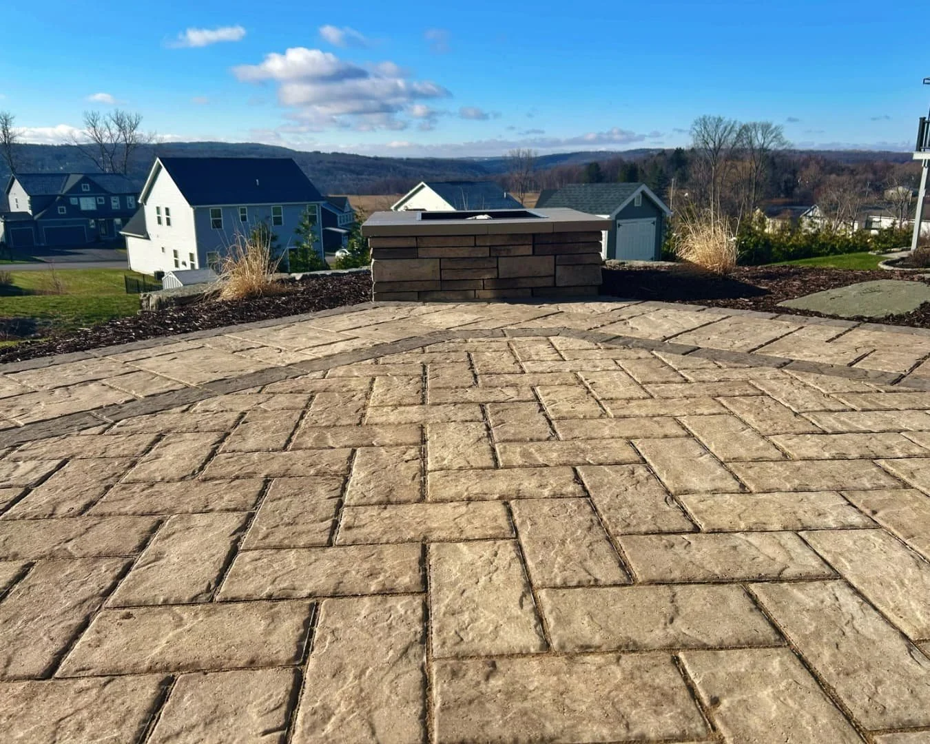 Large paver patio installation completed by Pines and Pavers in Lysander, New York.