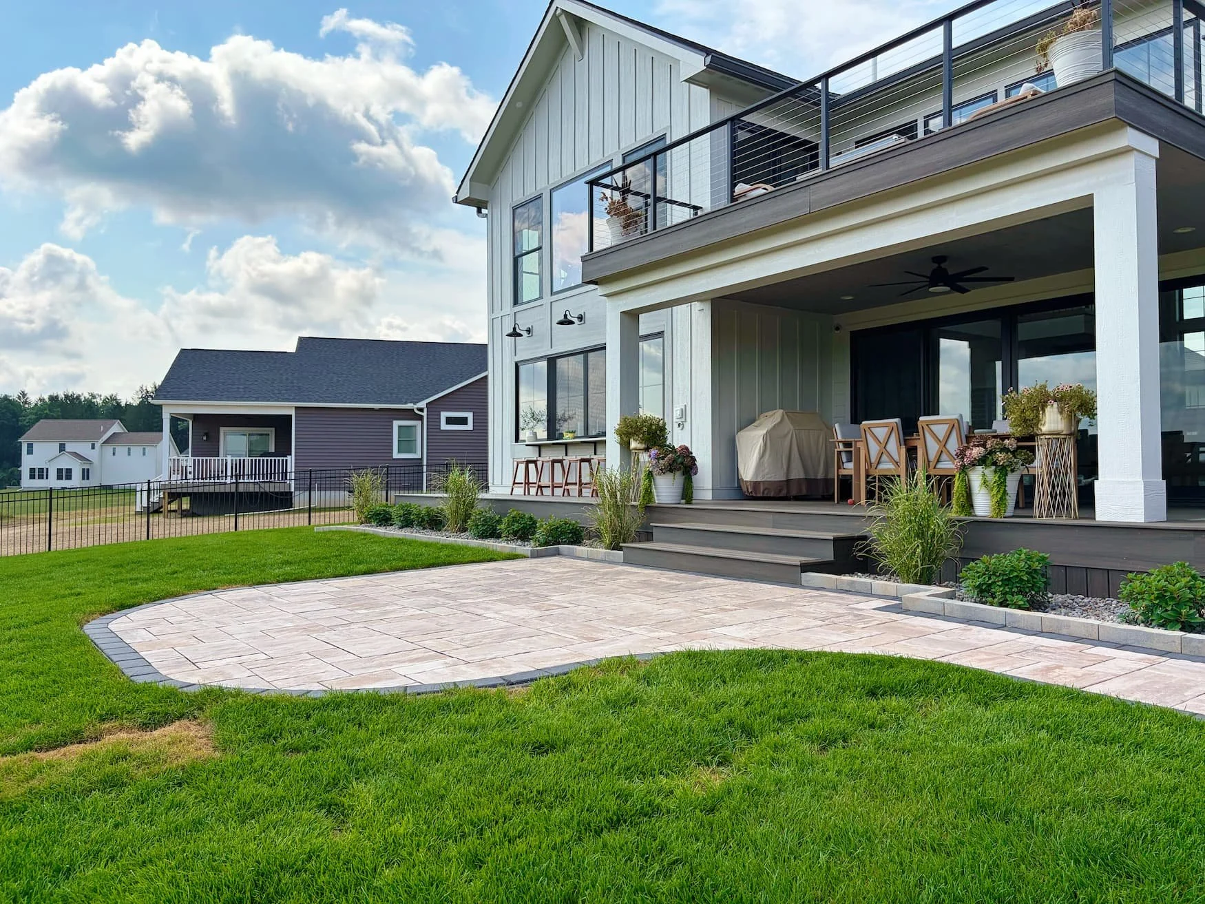 Wide view of a completed backyard patio designed for outdoor living in Central New York