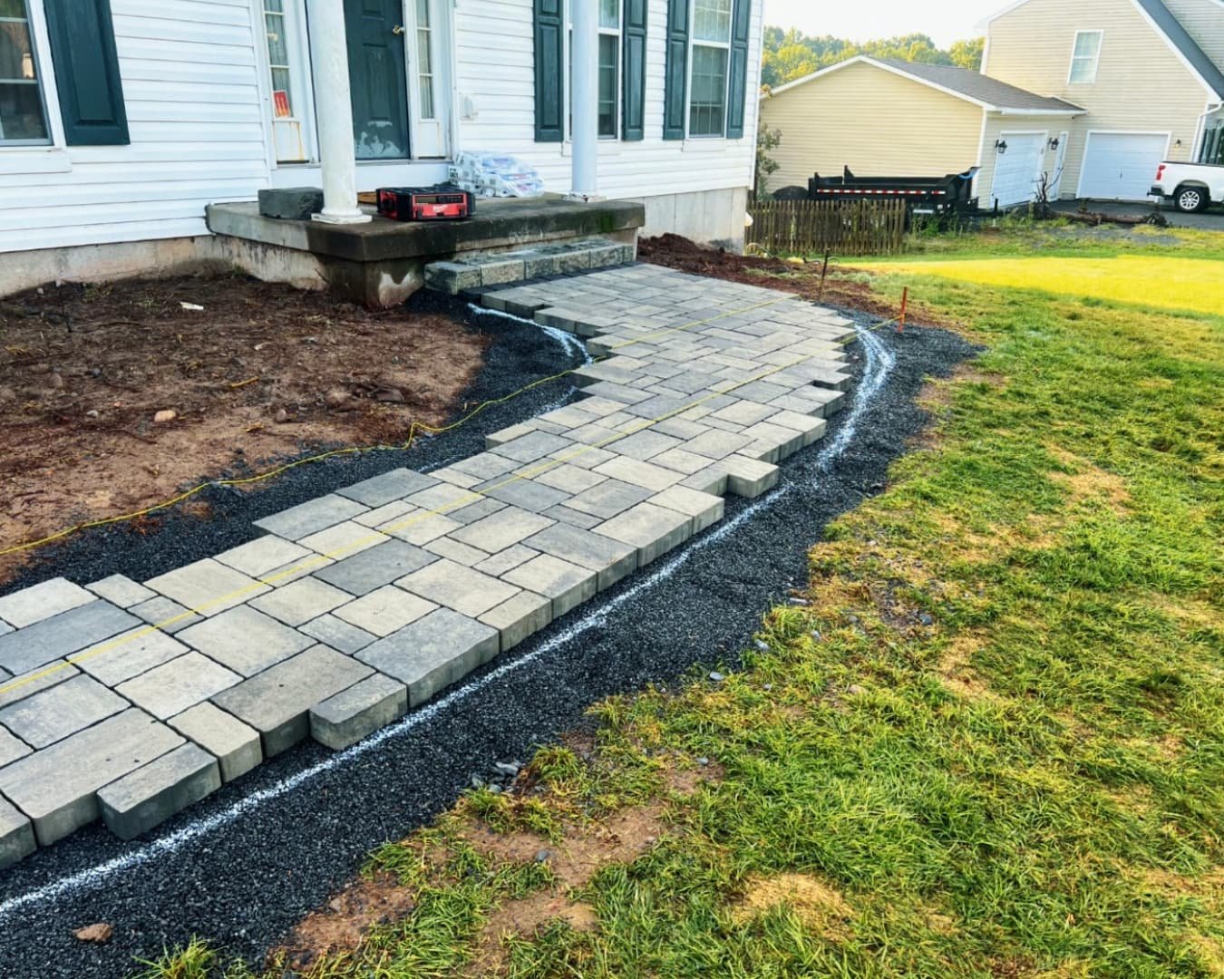 Natural stone and hardscape edge detail at an Upstate New York residential landscape installation.