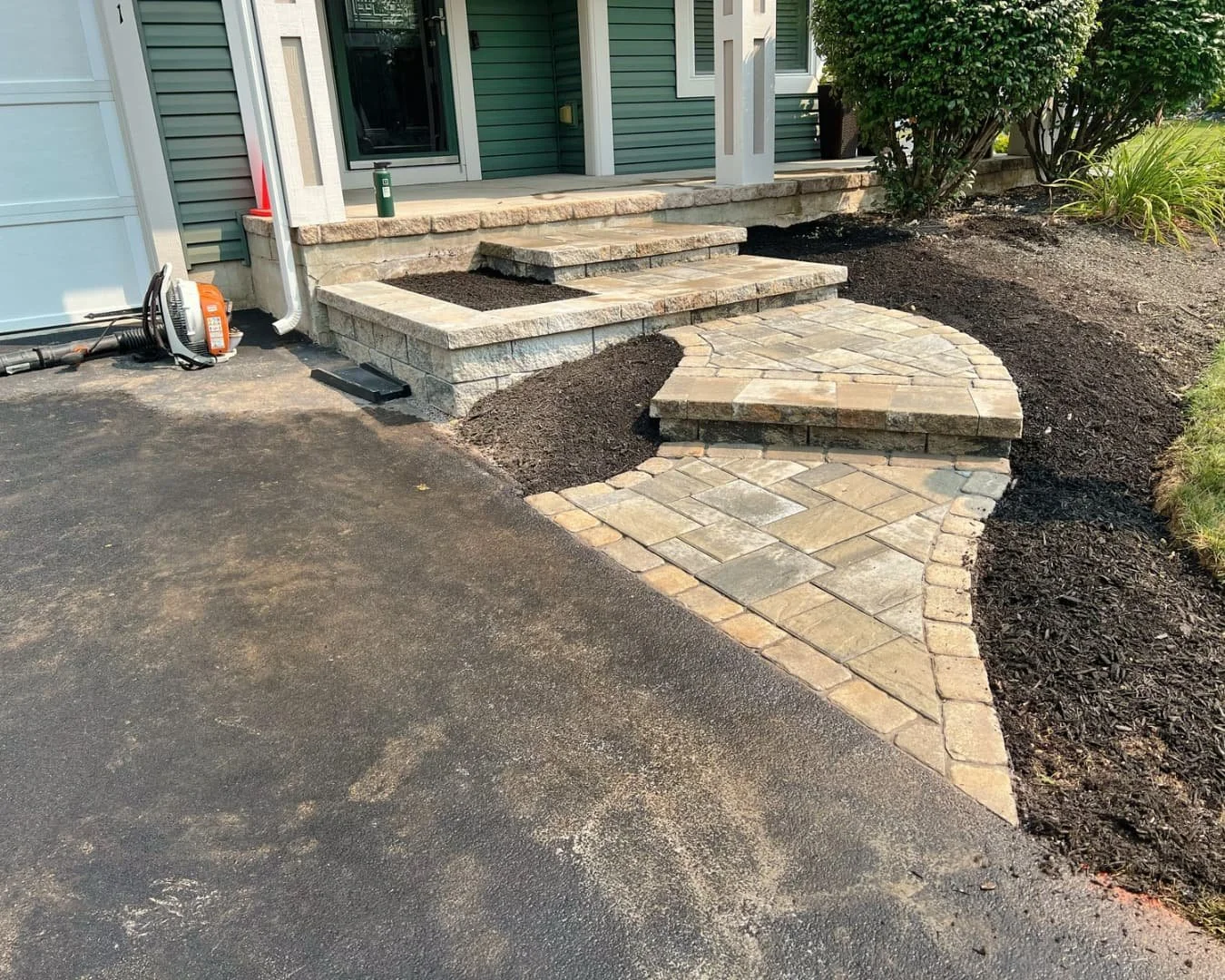Front step and walkway design completed by Pines and Pavers in Manlius, New York.