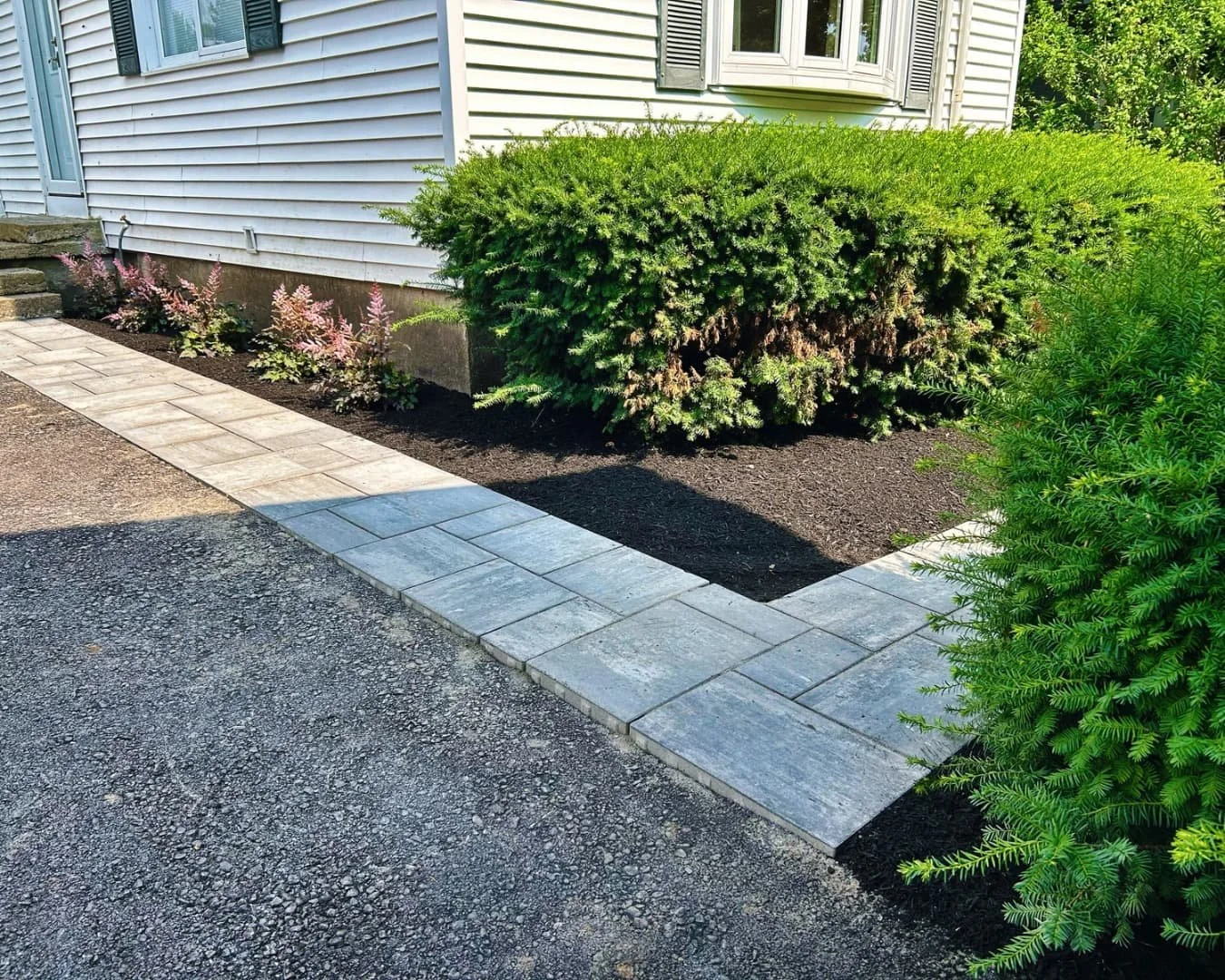 Paver patio pad beside the outbuilding completed by Pines and Pavers in Cazenovia, New York.