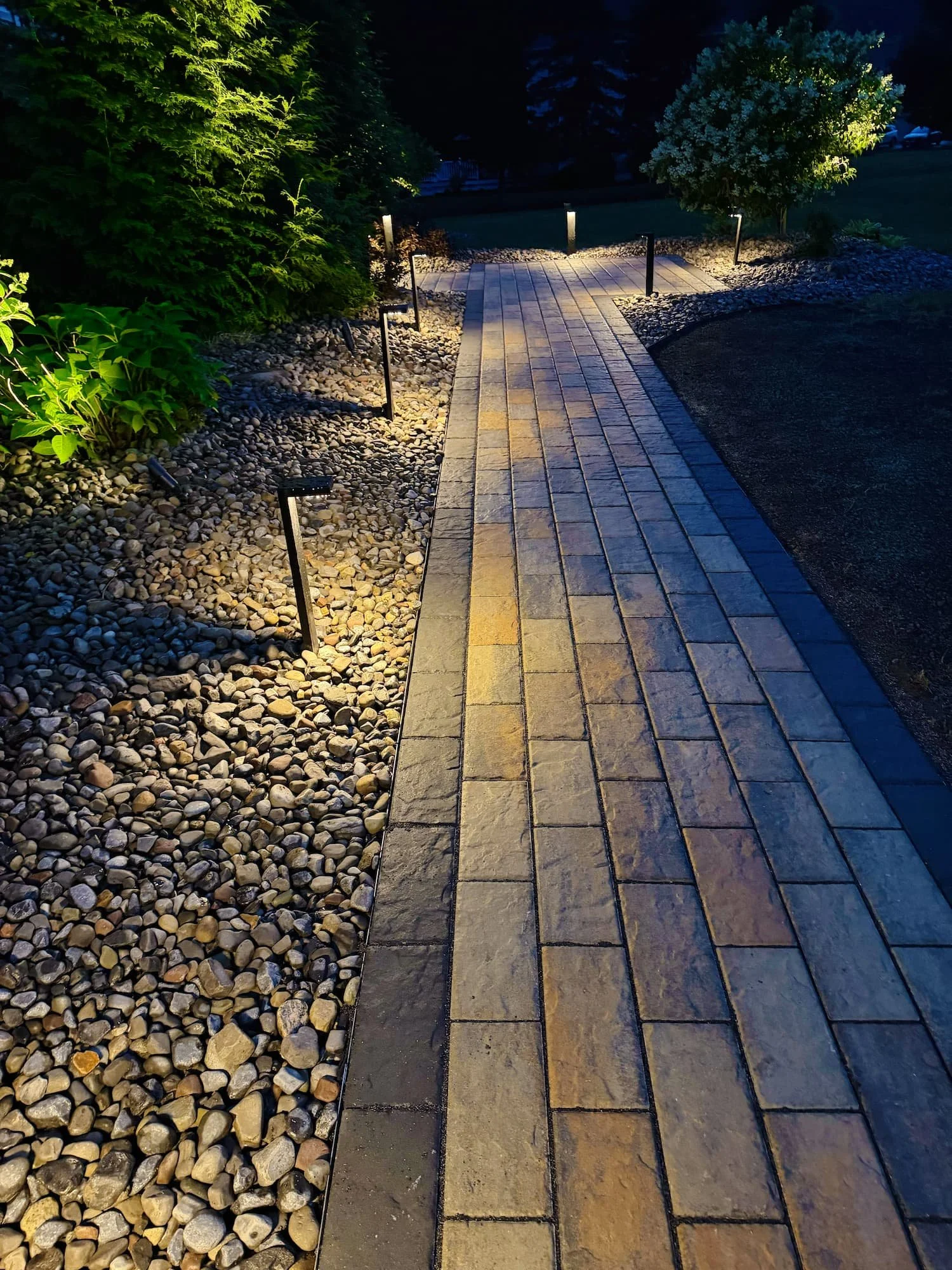 Custom paver walkway creating a polished entrance to a residential property in Central NY.