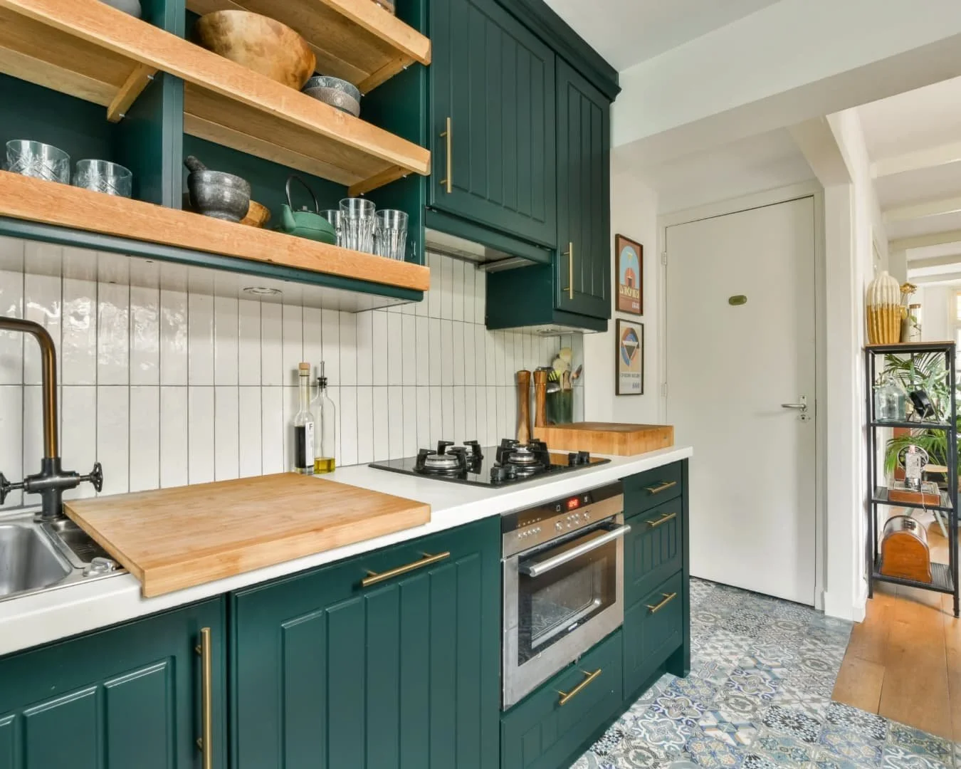 Kitchen inspiration with green cabinetry, open wood shelving, and a bright updated layout.