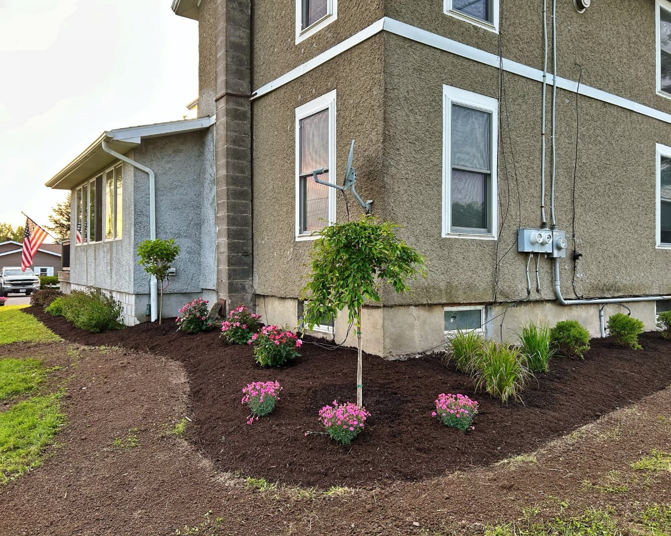 Paver entry patio with stone columns completed by Pines and Pavers in Fayetteville, New York.