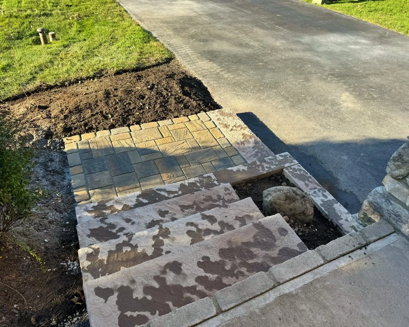 Front entry step rebuild detail completed by Pines and Pavers in Skaneateles Falls, New York.
