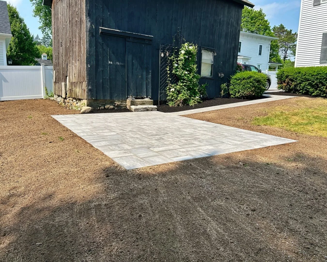 Square paver patio installation completed by Pines and Pavers in Cazenovia, New York.