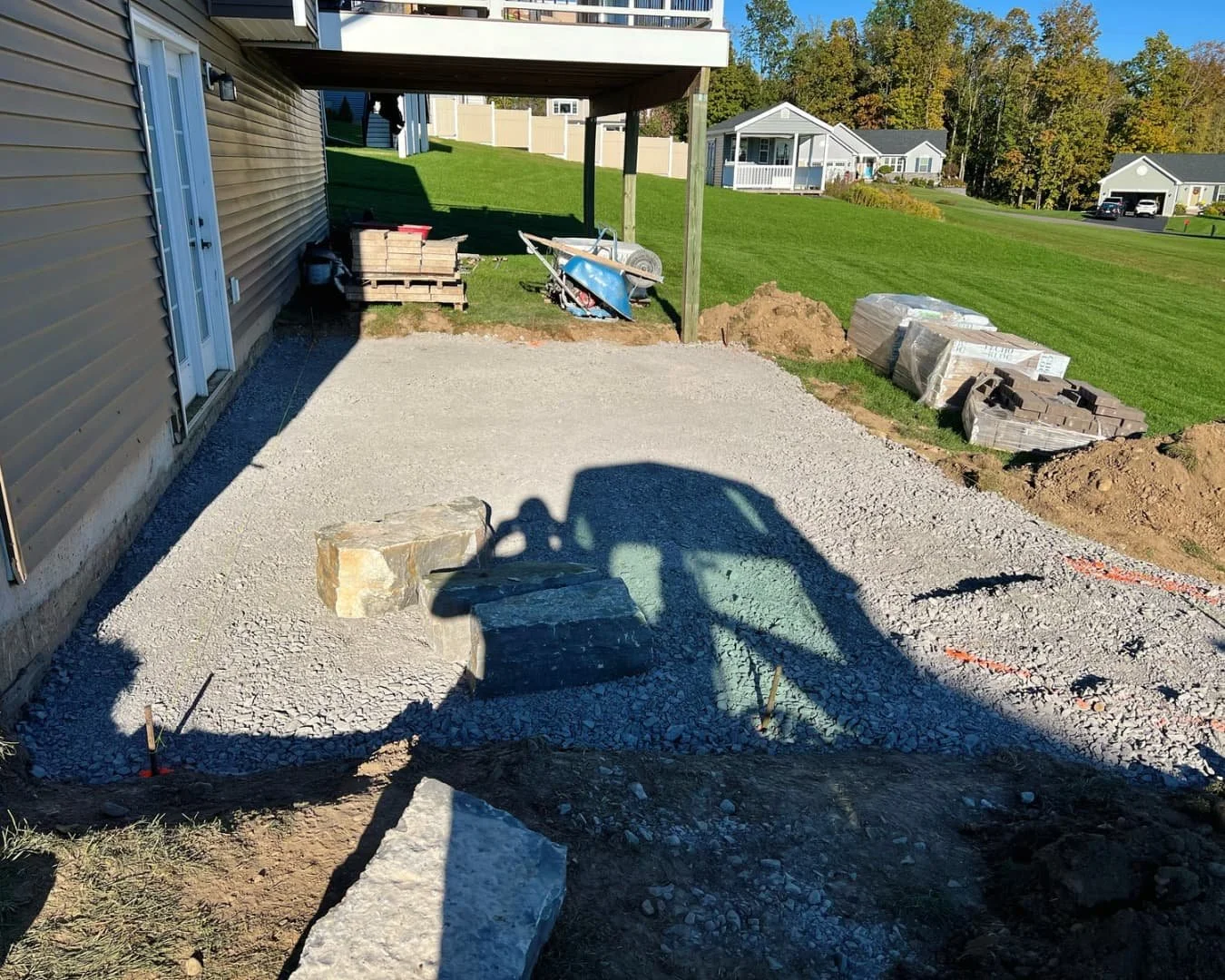 Under-deck excavation and base preparation by Pines and Pavers in Lysander, New York.