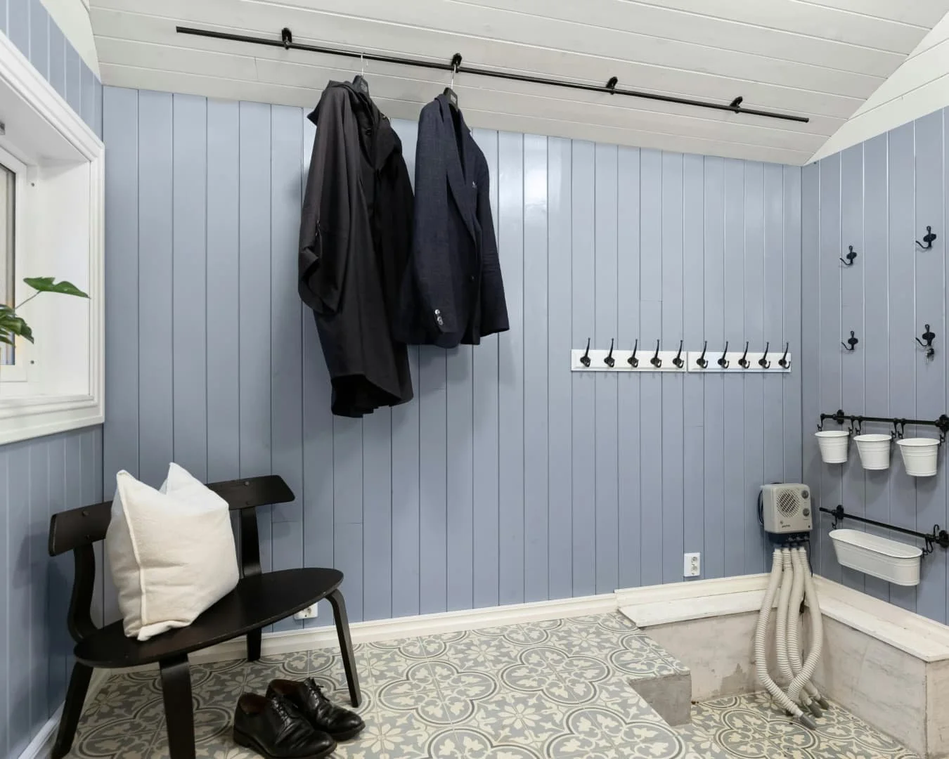 Mudroom inspiration with a bench, wall hooks, and built-in storage for everyday entry organization.