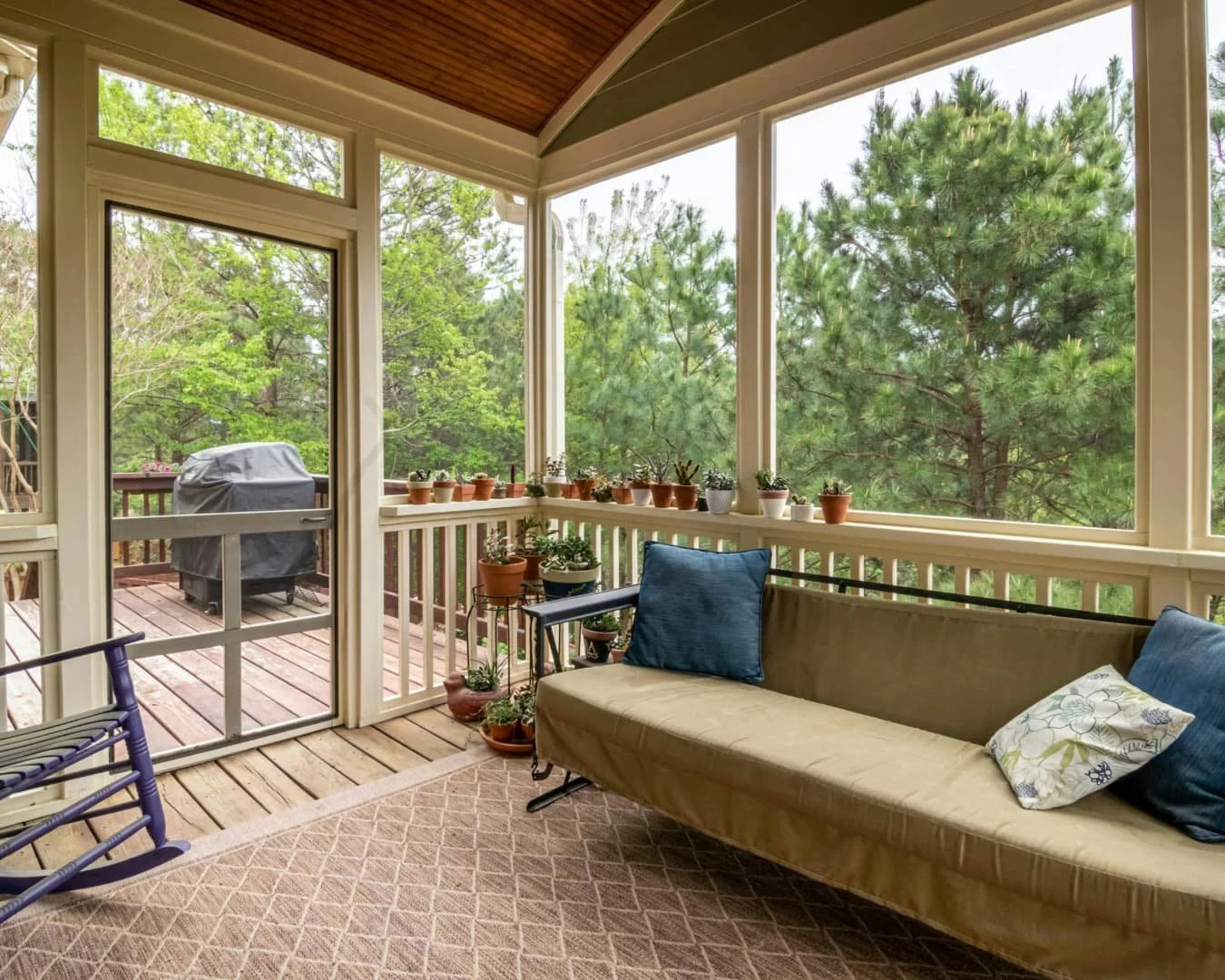 Sunroom inspiration featuring a covered lounge space with comfortable seating and a warm inviting layout.