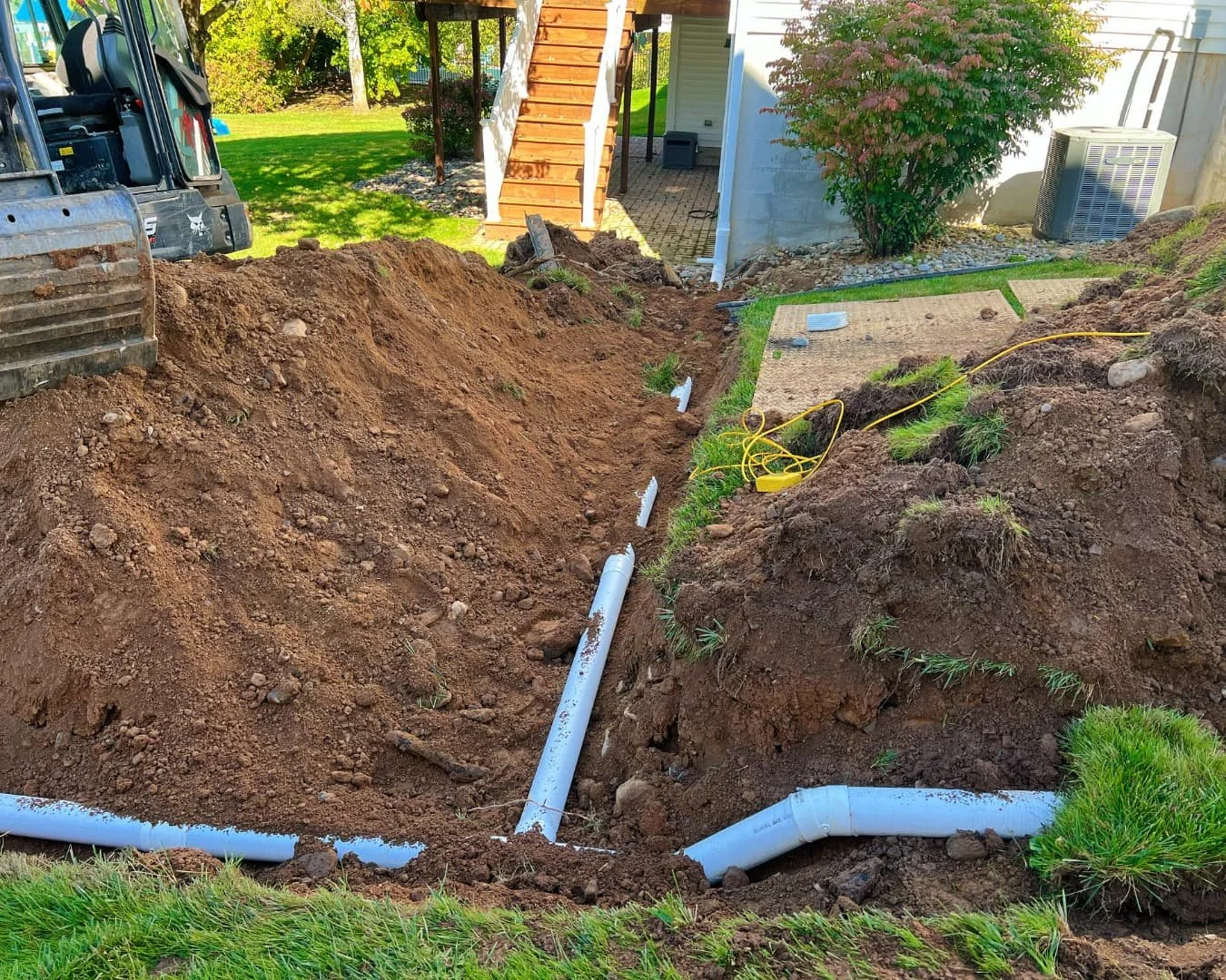 Side foundation area during excavation by Pines and Pavers in Lysander, New York.