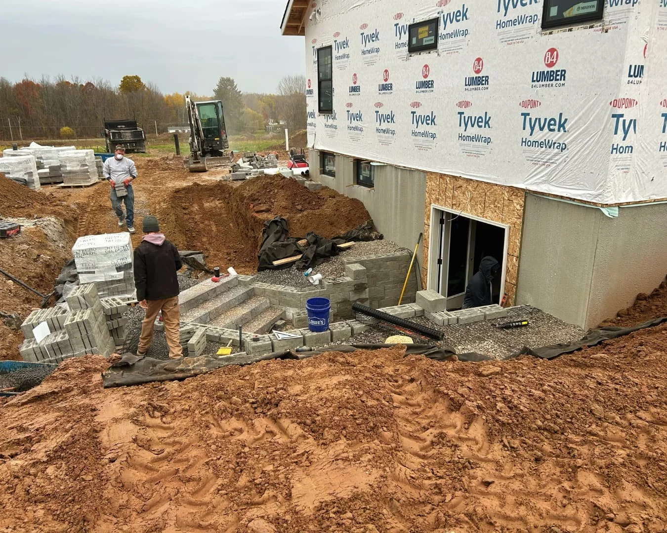Step wall installation in progress by Pines and Pavers in Cazenovia, New York.