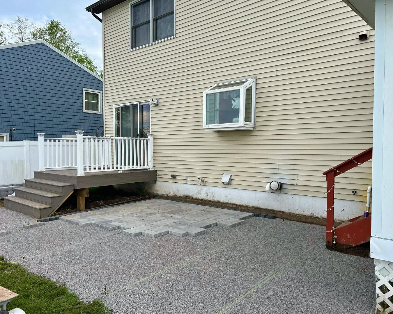 Existing concrete slab and yard before renovation by Pines and Pavers in Marcellus, New York.