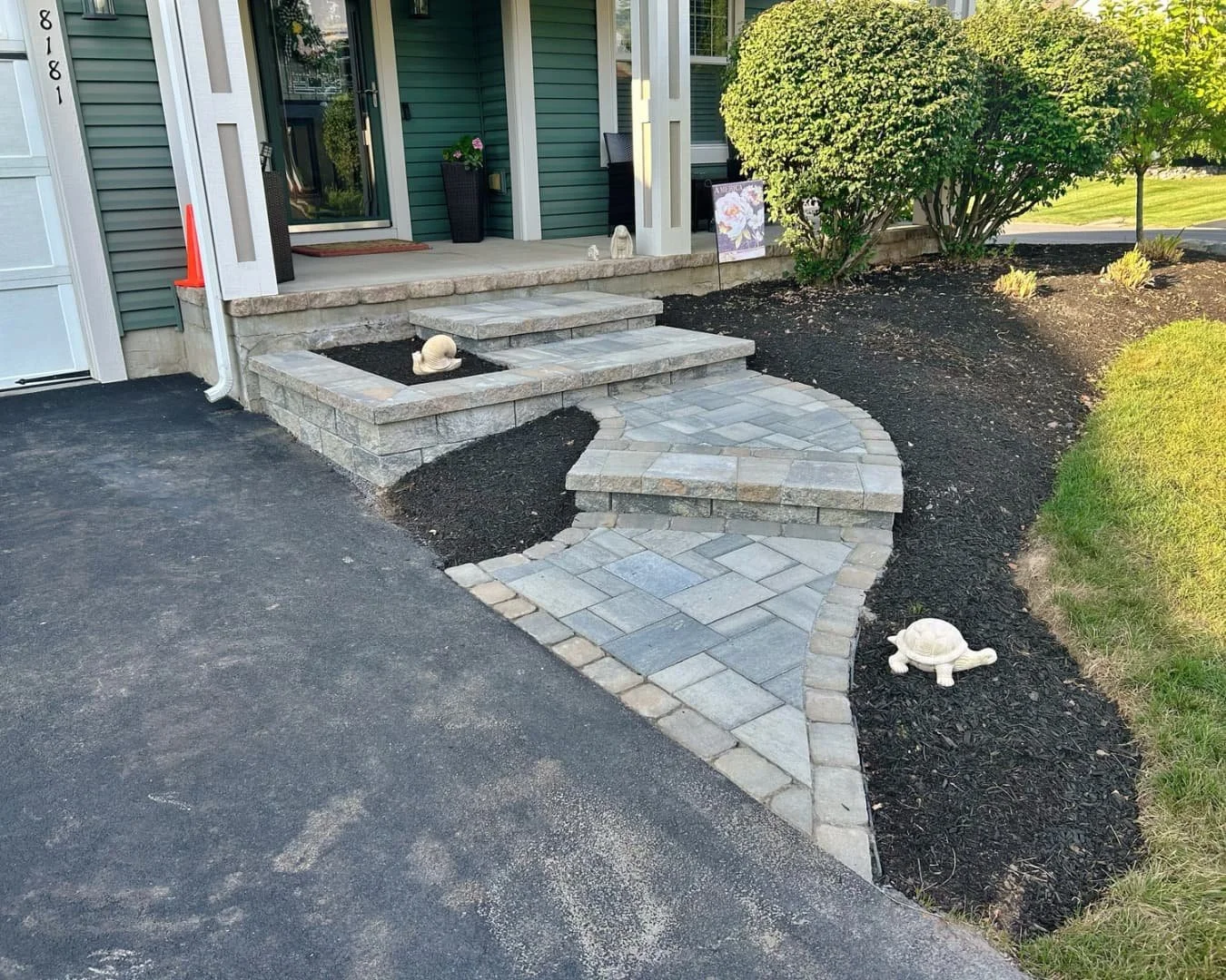 Front entry hardscape overview completed by Pines and Pavers in Manlius, New York.