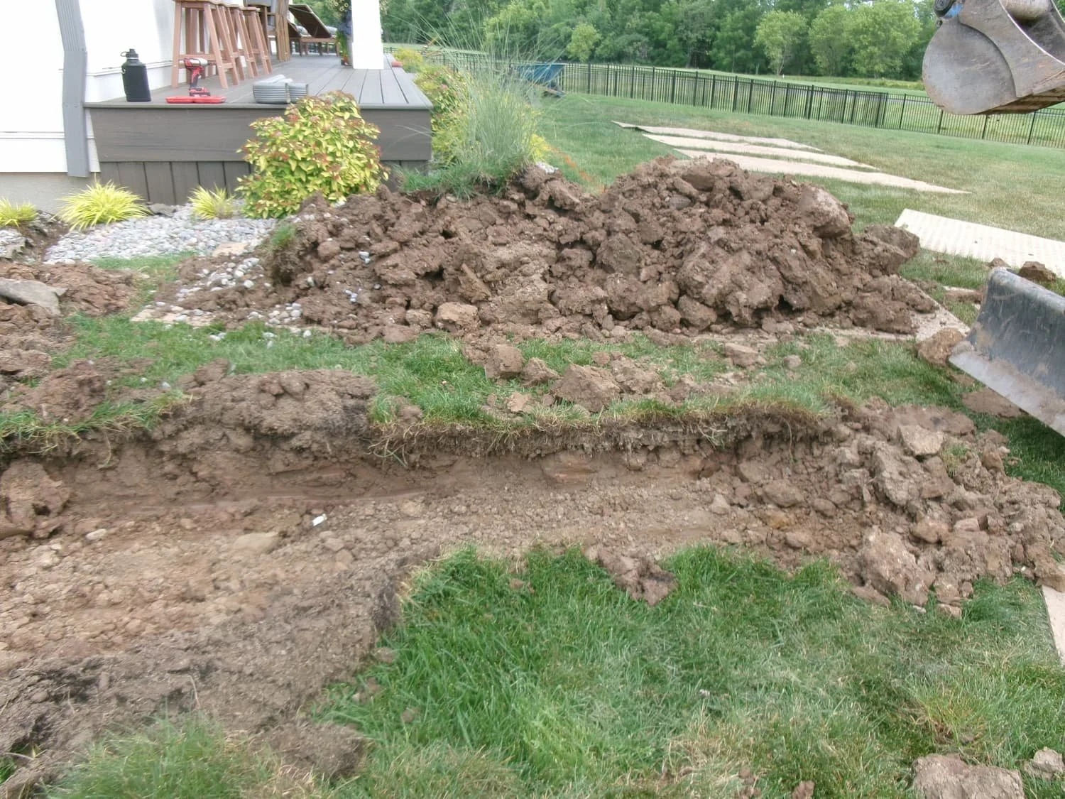 Wide view of a Central New York backyard before new landscaping and outdoor living improvements