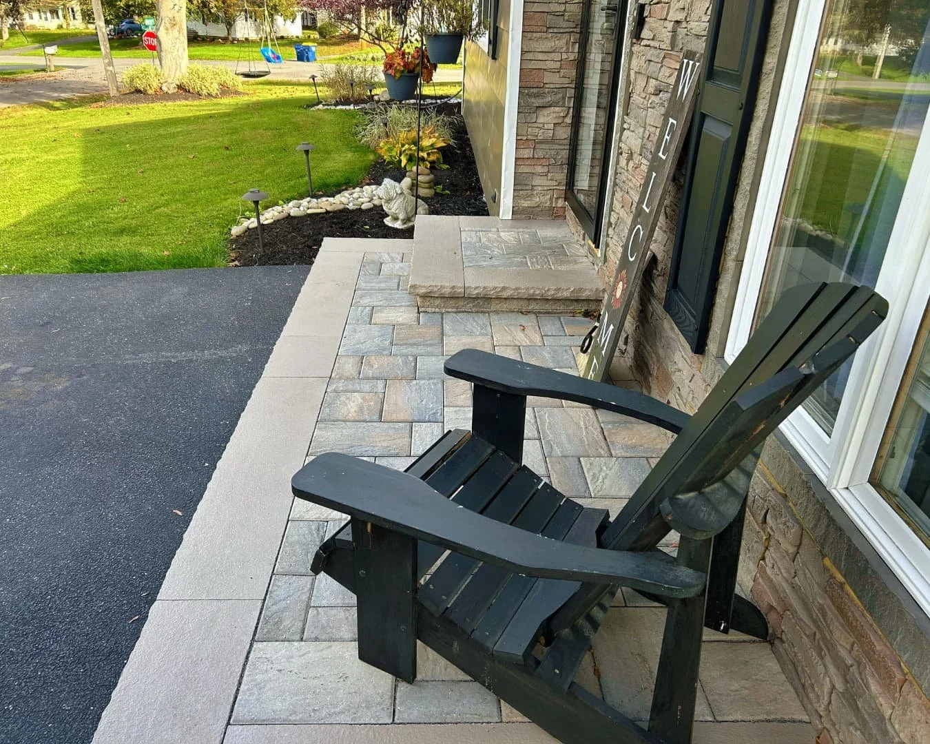 Completed front entry patio and step by Pines and Pavers in Camillus, New York.