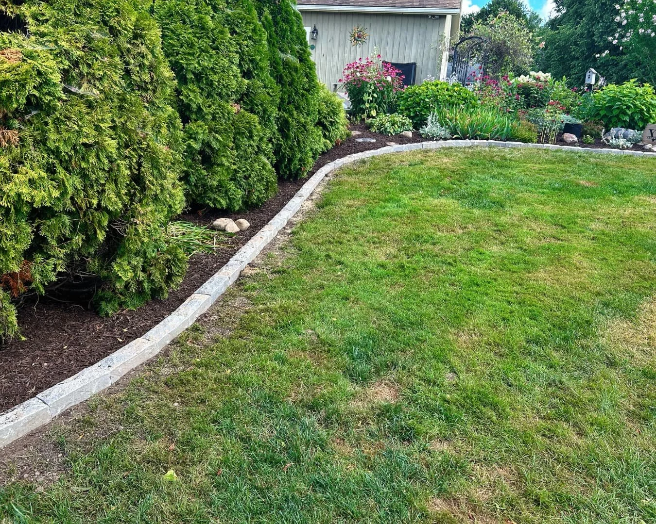 Front yard landscape overview completed by Pines and Pavers in Skaneateles, New York.