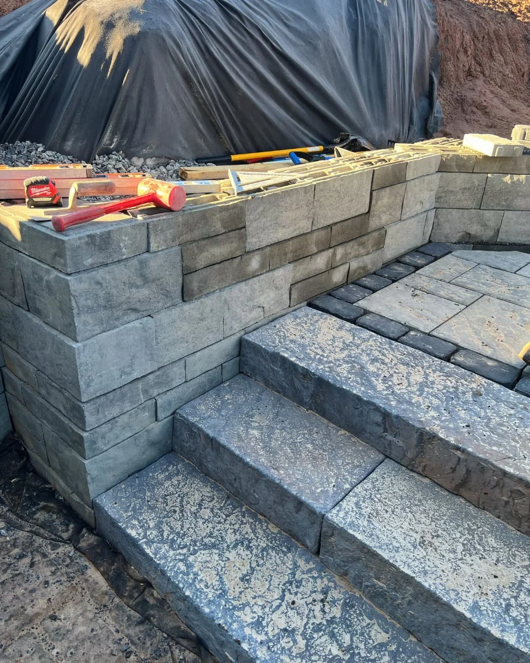Wall and step detail under construction by Pines and Pavers in Cazenovia, New York.