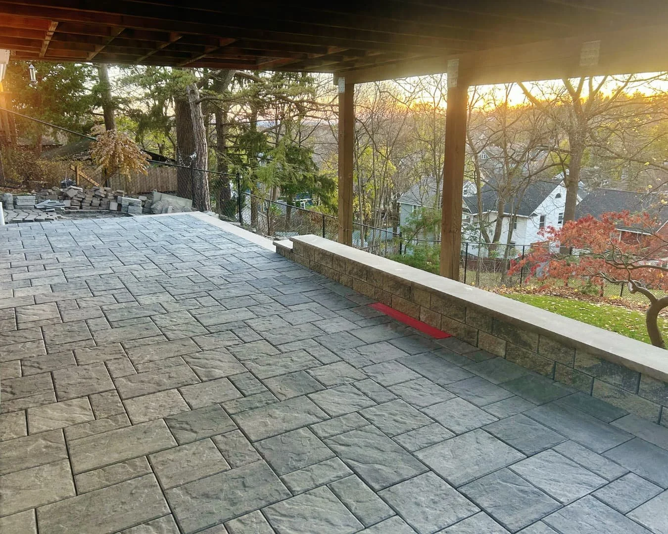 Side view of a covered paver patio project completed by Pines and Pavers in Central New York.