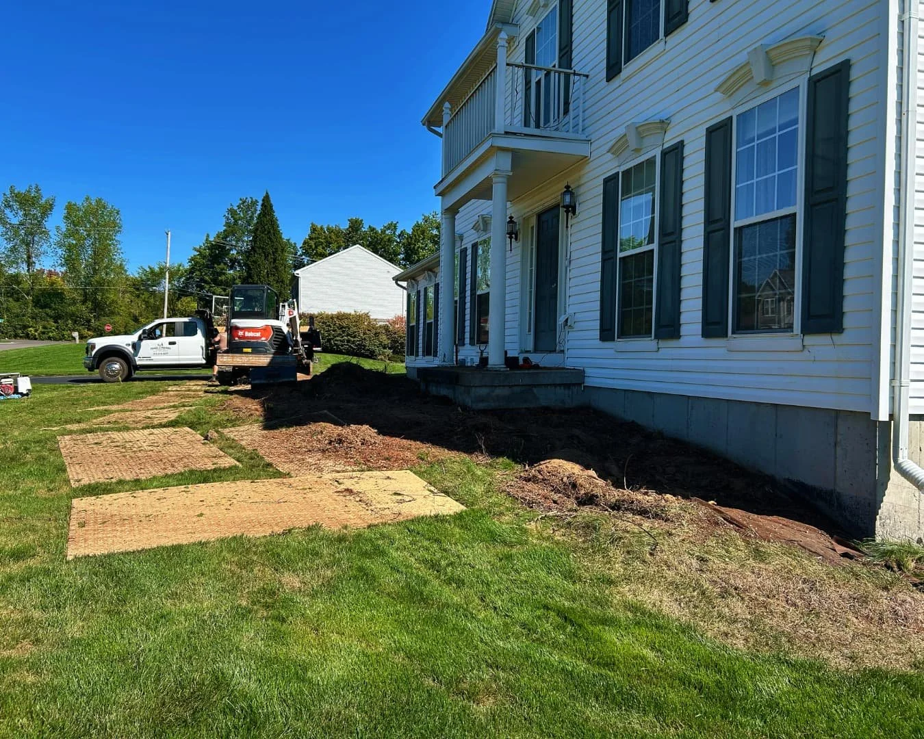 Rear yard before patio installation by Pines and Pavers in Baldwinsville, New York.