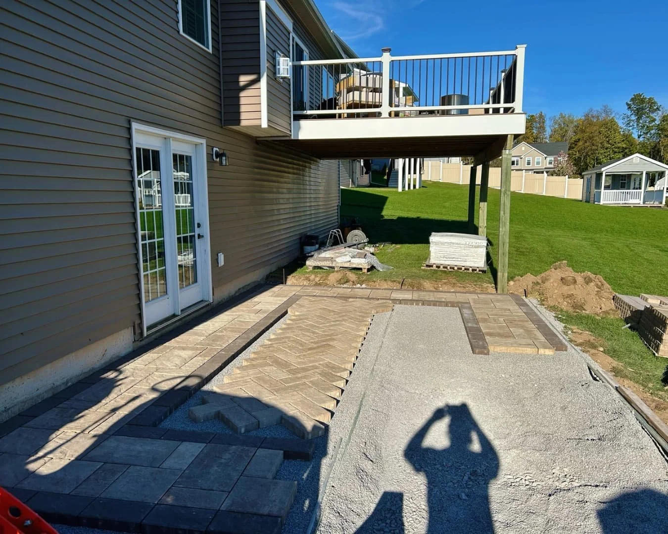 Site preparation beside the home by Pines and Pavers in Lysander, New York.