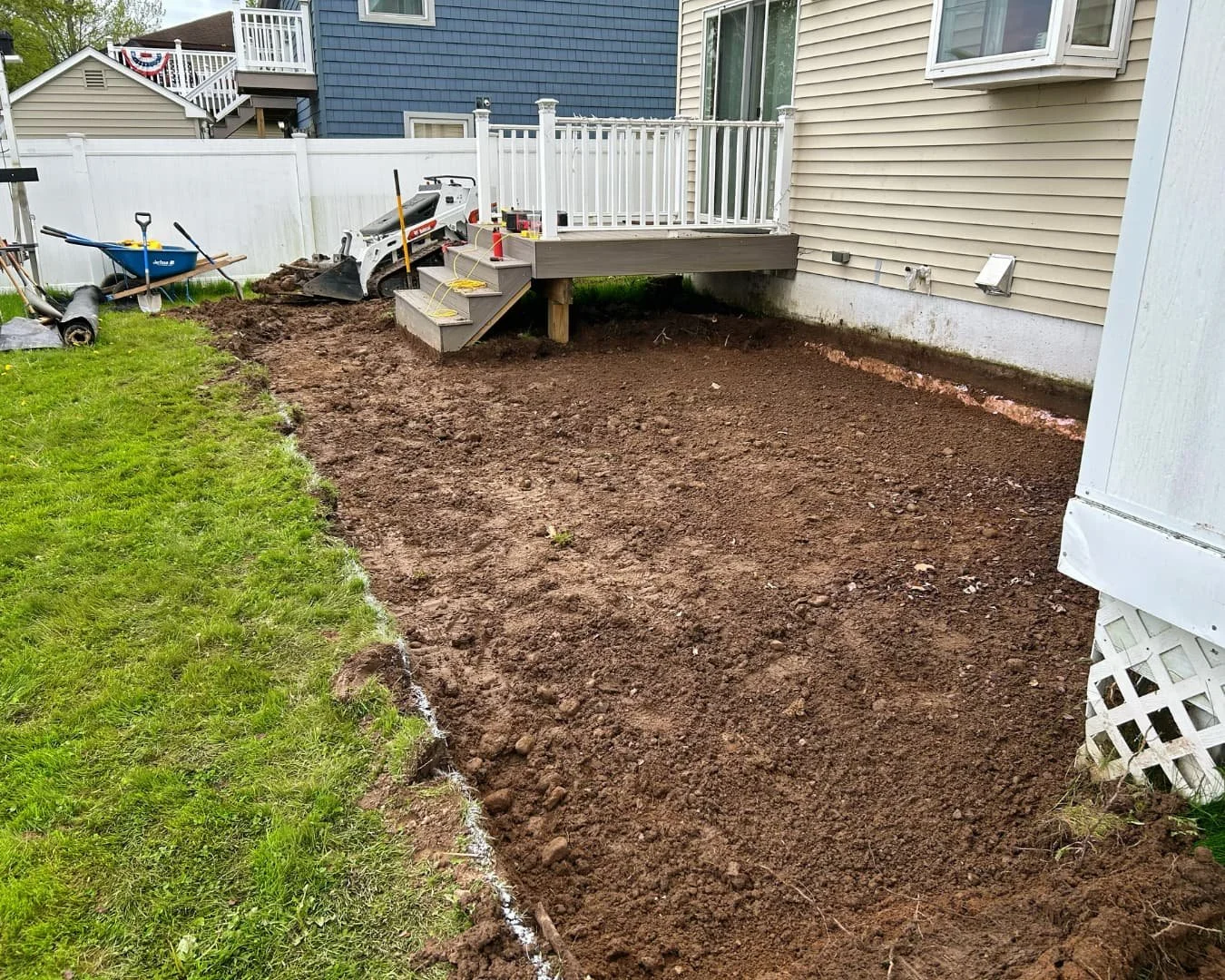 Backyard grading area before patio installation by Pines and Pavers in Marcellus, New York.
