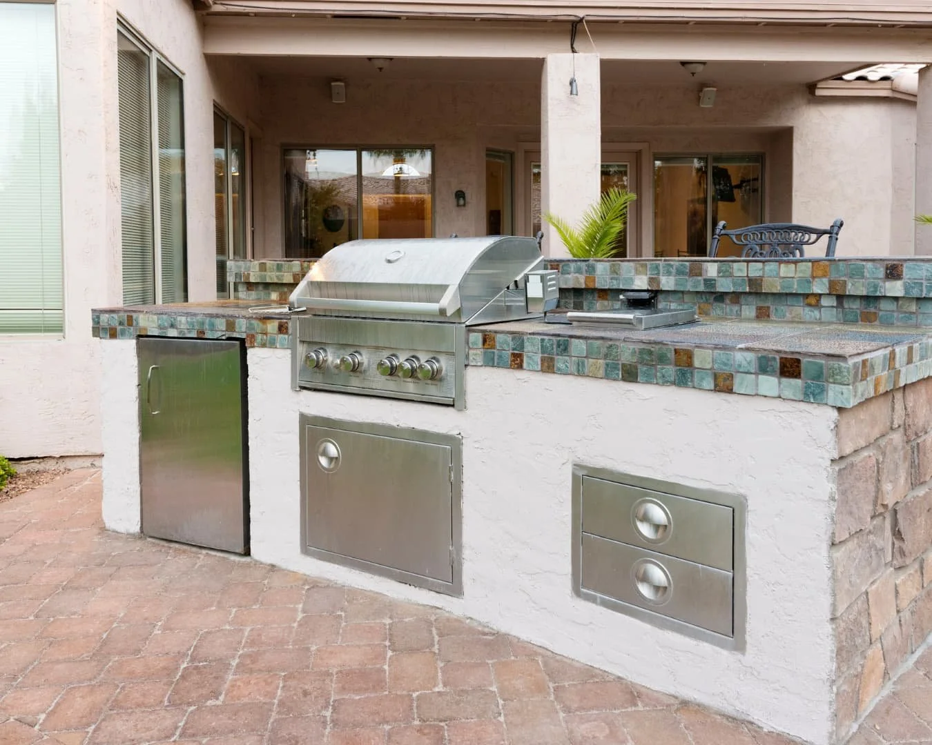 Outdoor kitchen inspiration with a stone grill station and built-in counter space for cooking outside.