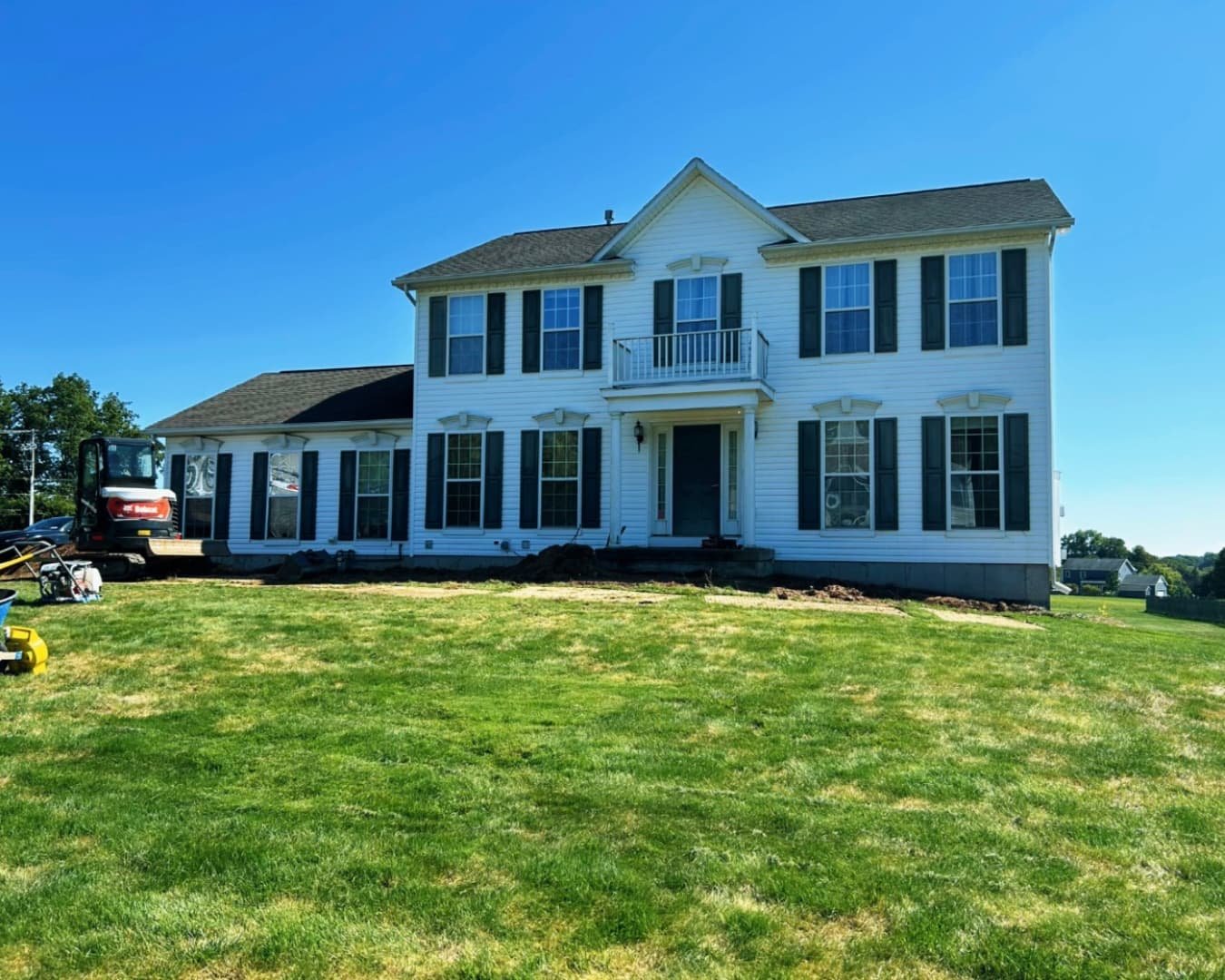 Curved paver path detail at an Upstate New York residence with contrasting stone textures and clean joint lines.