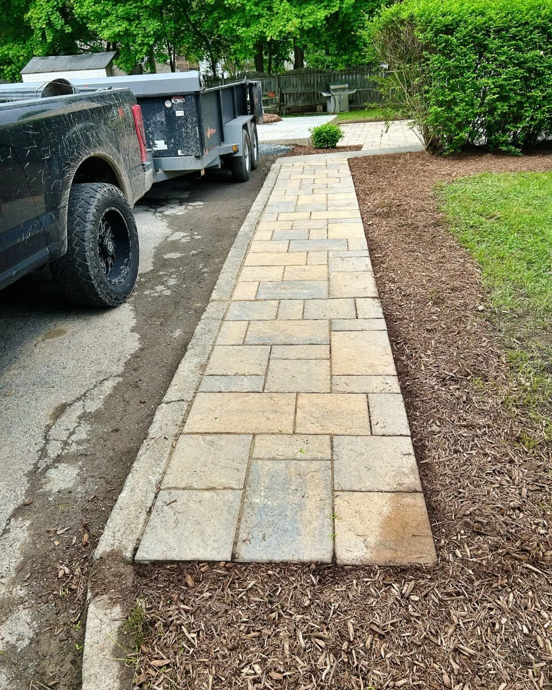 Front walkway with paver path completed by Pines and Pavers in Central New York.