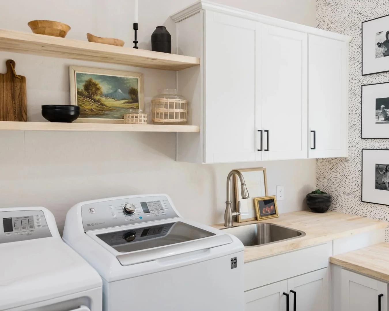 Mudroom inspiration with laundry appliances, upper cabinetry, and compact built-in storage.