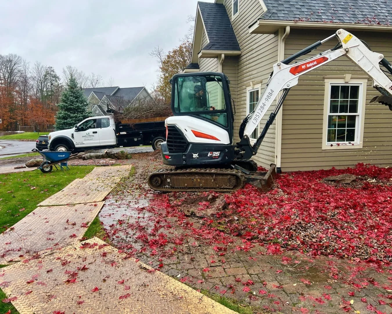 Front yard landscape overview with a mature tree by Pines and Pavers in Fayetteville, New York.
