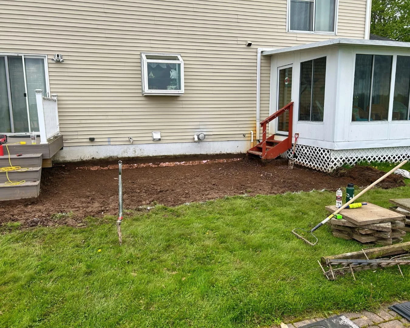 Backyard patio area before installation by Pines and Pavers in Marcellus, New York.