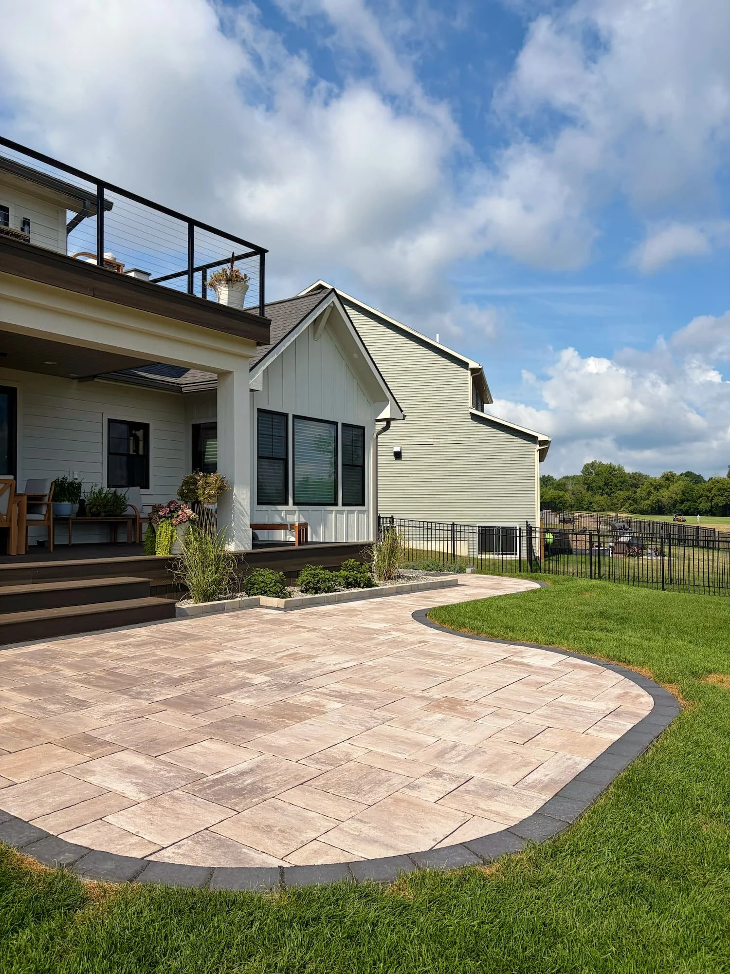 Finished paver patio and landscaped backyard at a Central New York residence