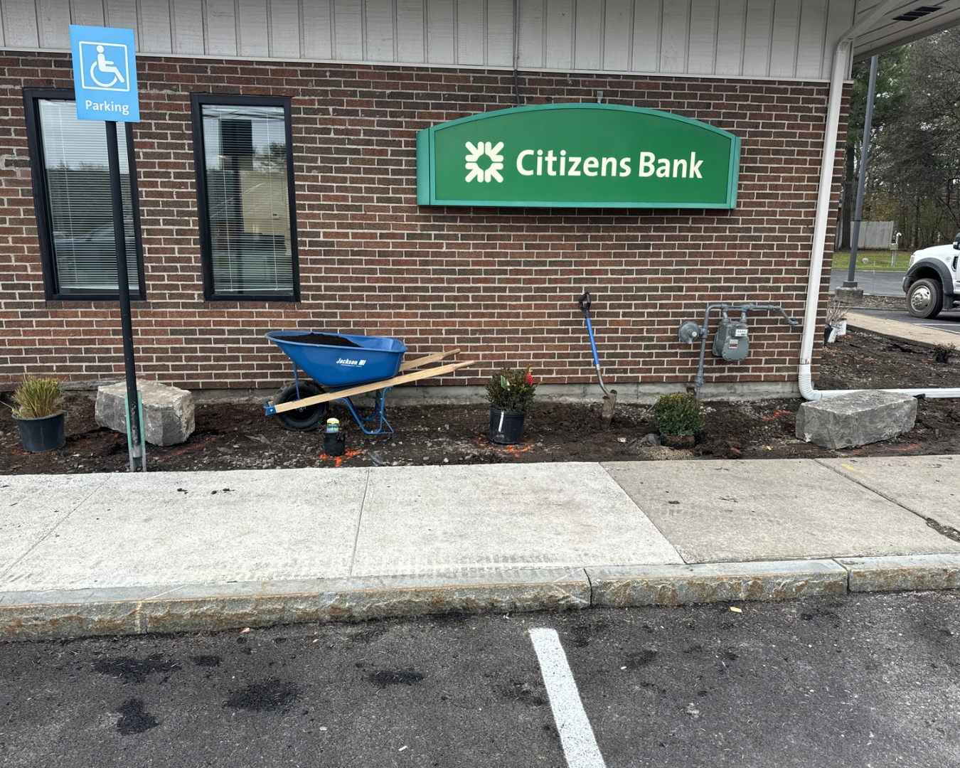 Commercial foundation landscaping at a Fayetteville, NY bank branch with refreshed beds and clean curb appeal.