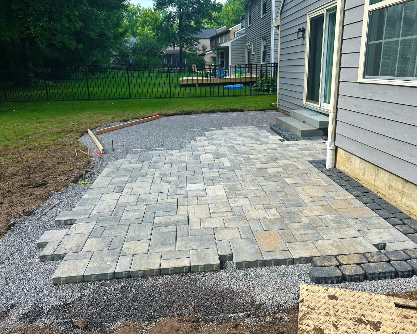 Backyard before patio and landscape work by Pines and Pavers in Brewerton, New York.