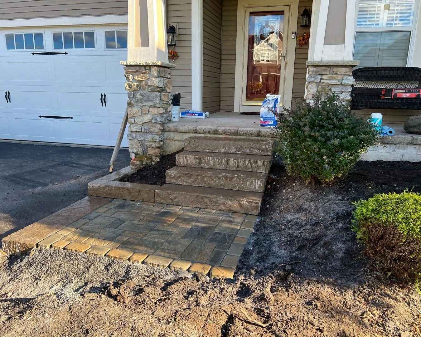 Entry hardscape installation in progress by Pines and Pavers in Skaneateles Falls, New York.