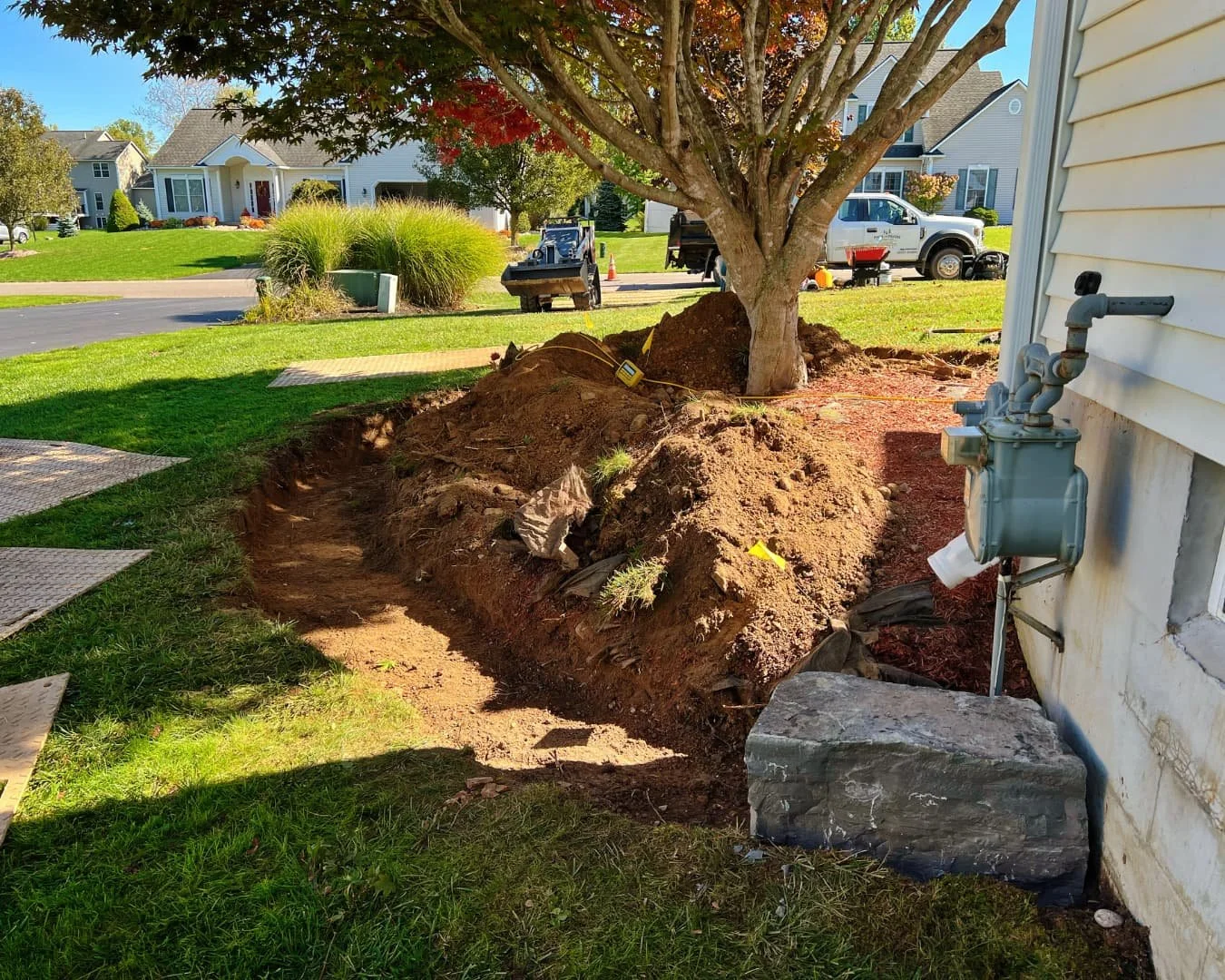 Front yard site preparation before planting by Pines and Pavers in Lysander, New York.