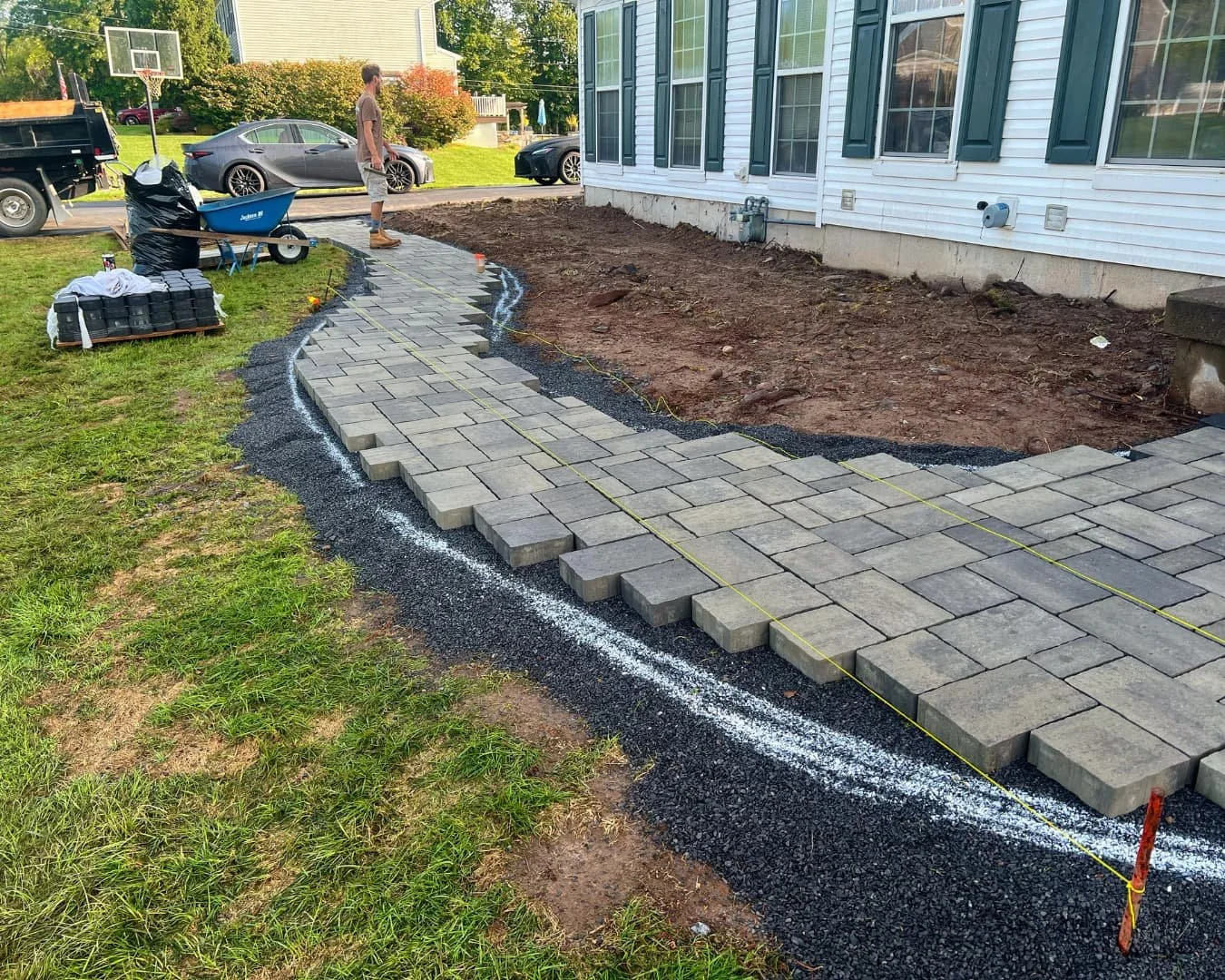 Curved paver walkway completed by Pines and Pavers in Baldwinsville, New York.