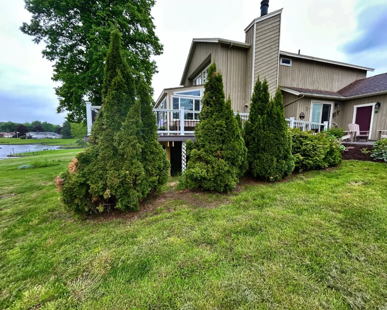 Front yard landscape bed overview completed by Pines and Pavers in Skaneateles, New York.