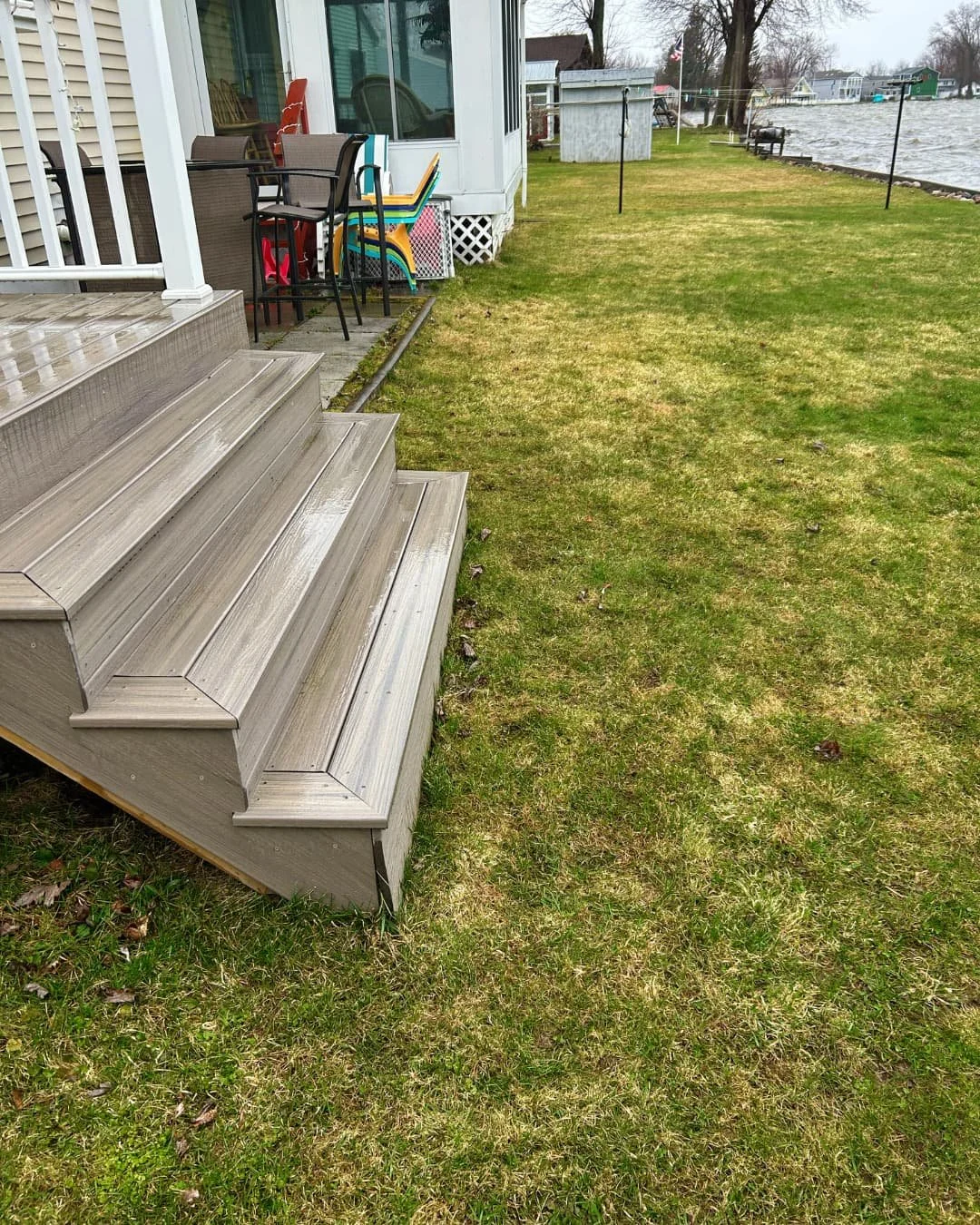 Backyard steps and lawn before the patio project by Pines and Pavers in Marcellus, New York.