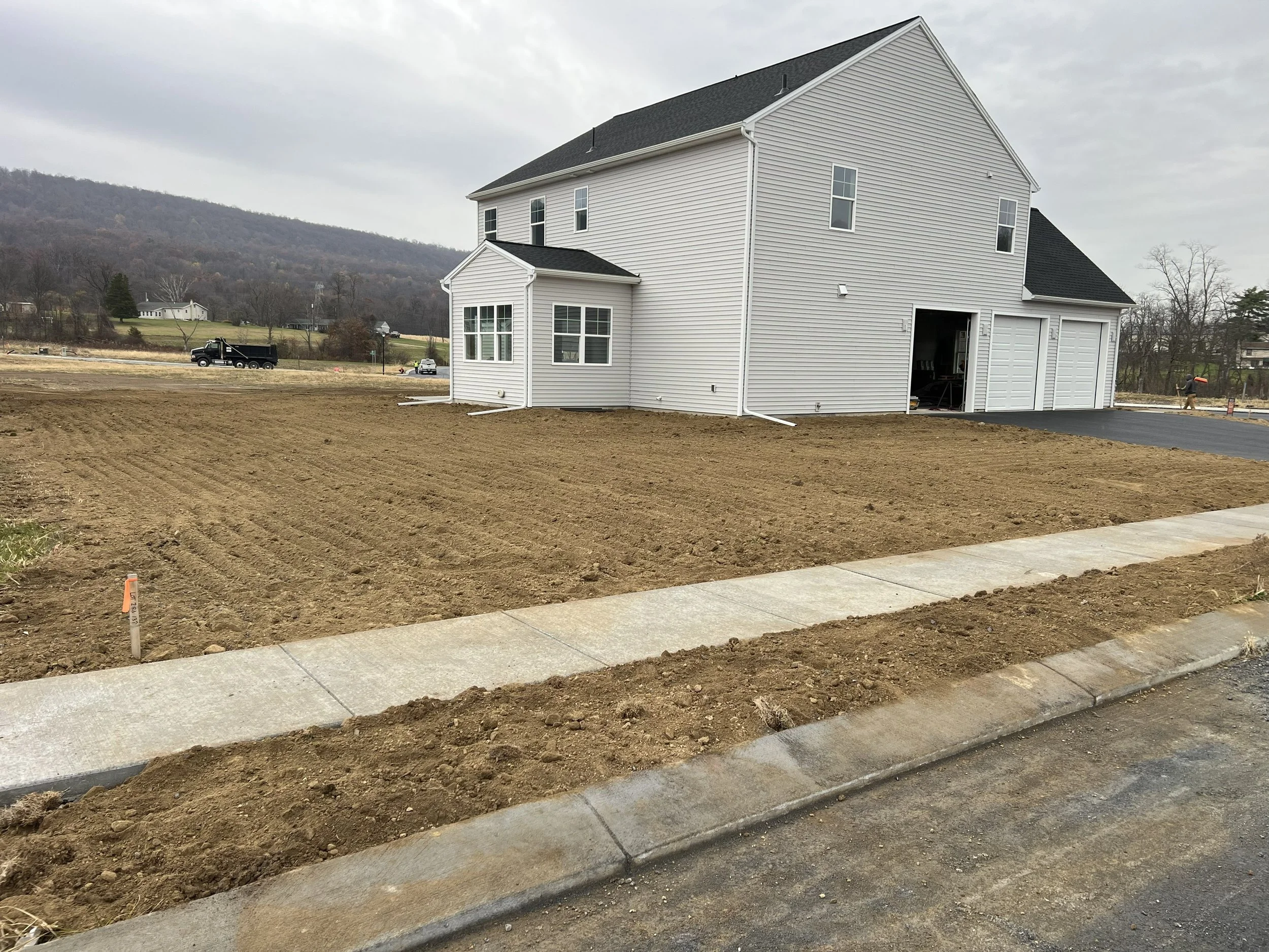 Residential excavation final grade completed and soil prepared for seeding by Deep Creek Ag Solutions in Central PA.