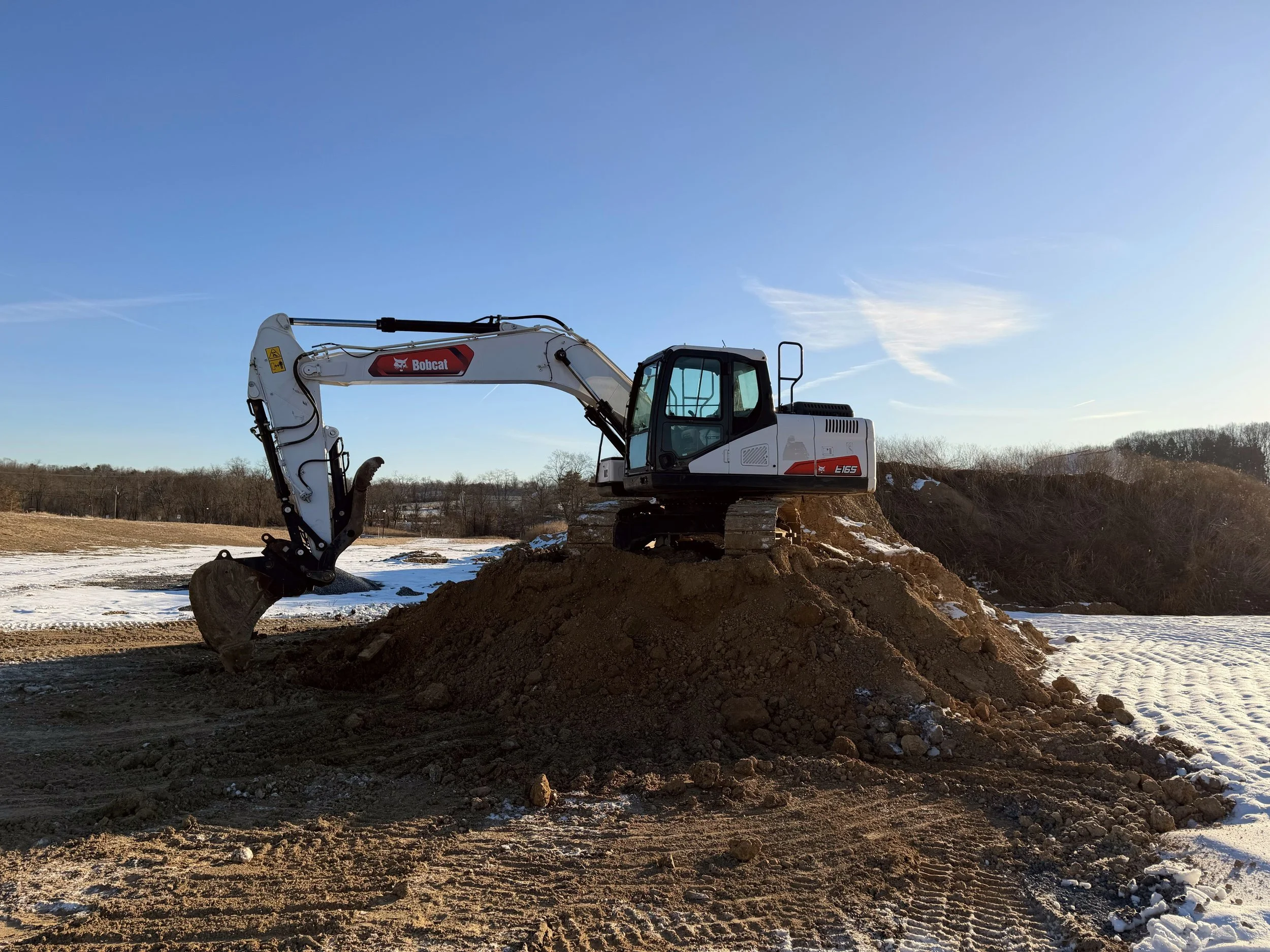 Deep Creek Ag Solutions excavator performing commercial and residential excavation work in Central Pennsylvania.