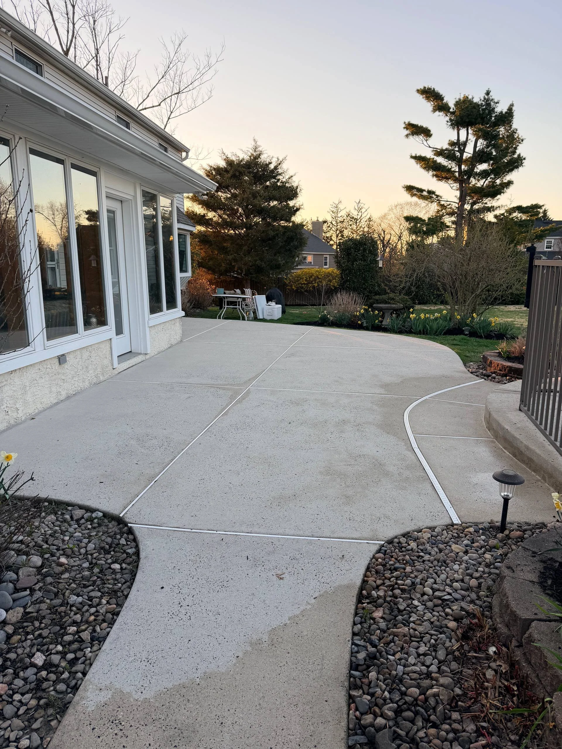 Clean backyard patio after power washing in Bucks County PA with restored surface and fresh appearance