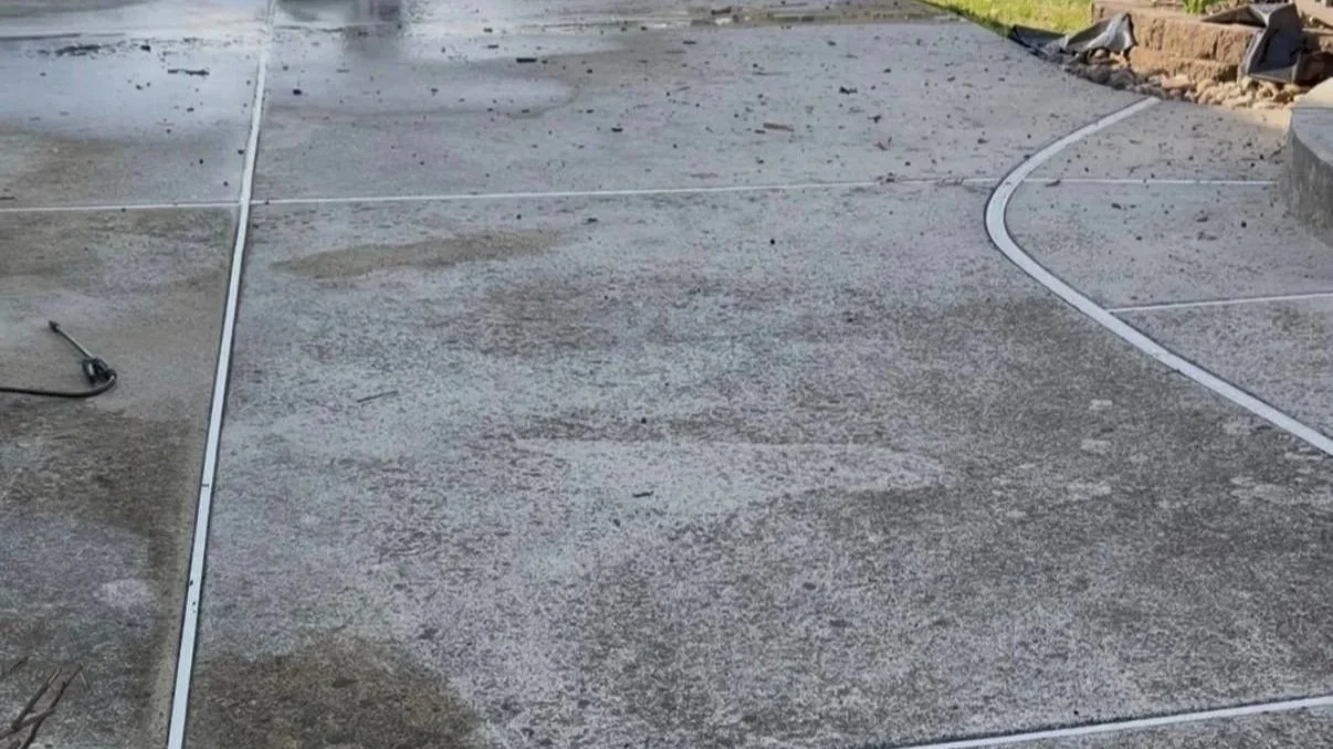 Dirty backyard patio before power washing in Bucks County PA with visible stains and buildup