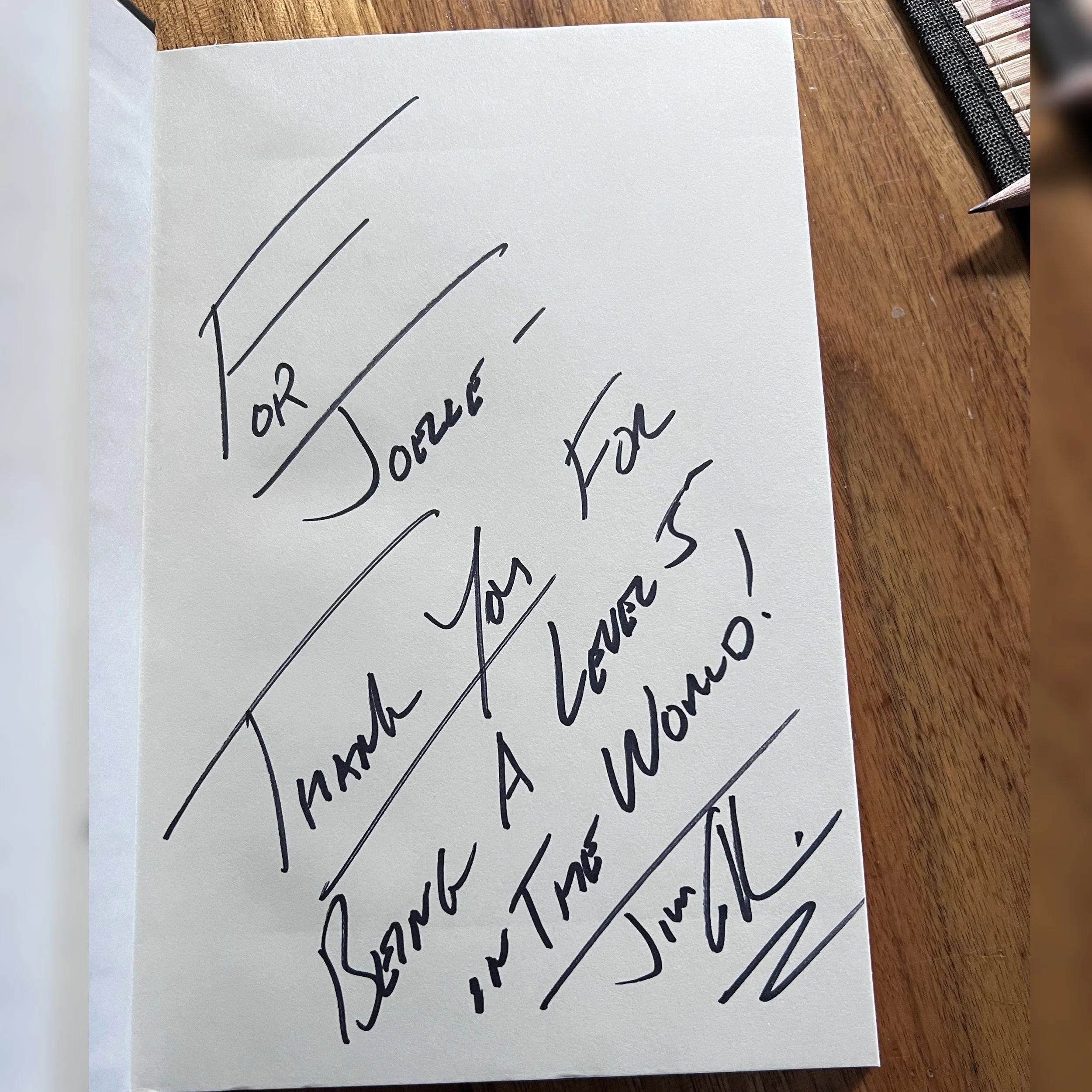 A signed copy of Jim Collins' book Good to Great